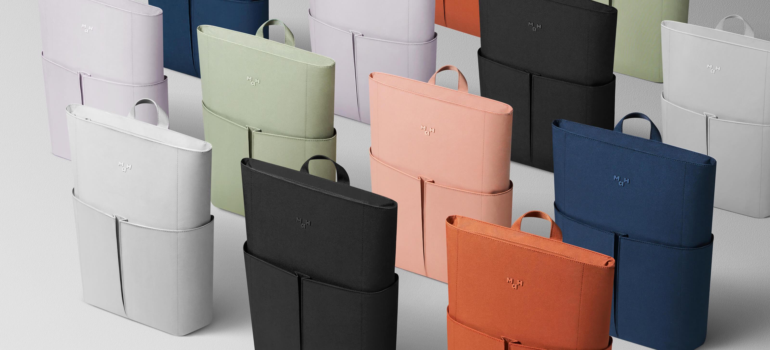 Modern minimalist tote bags in multiple colors, featuring sleek design and top handles for everyday use.
