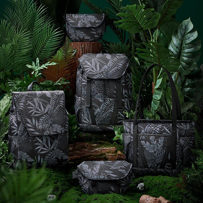Tropical leaf print backpacks, totes & accessories in lush jungle setting