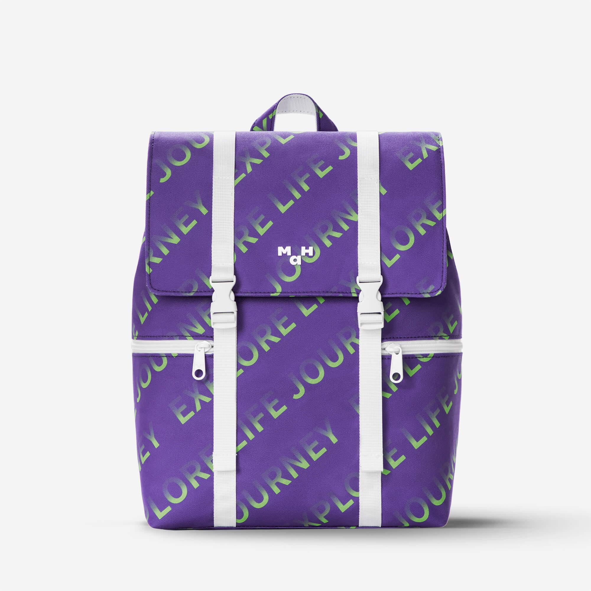 Purple backpack with green 'Explore Life Journey' print, white straps, and front pockets for daily use or travel.
