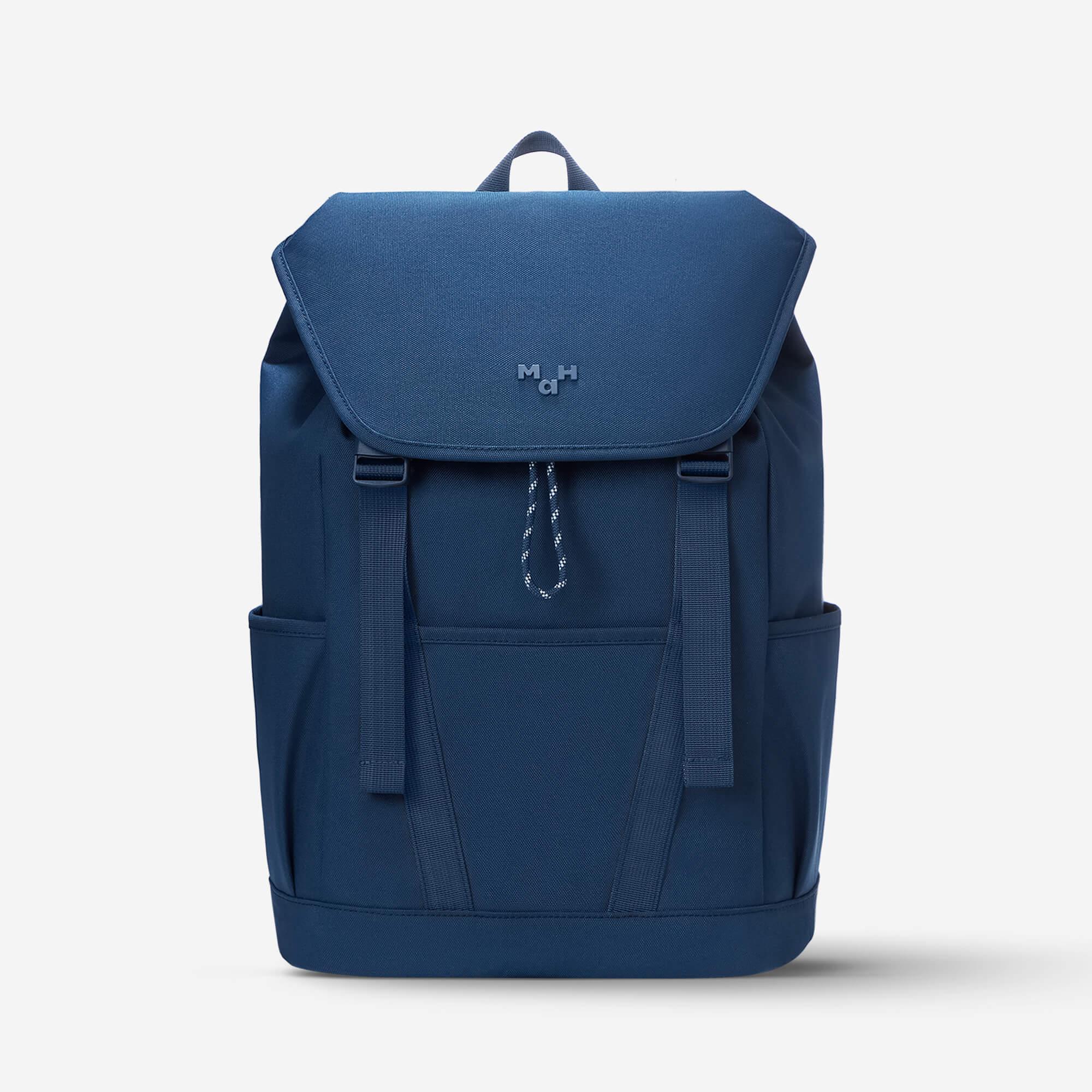Navy blue backpack with front flap, side pockets, and drawstring closure for everyday use