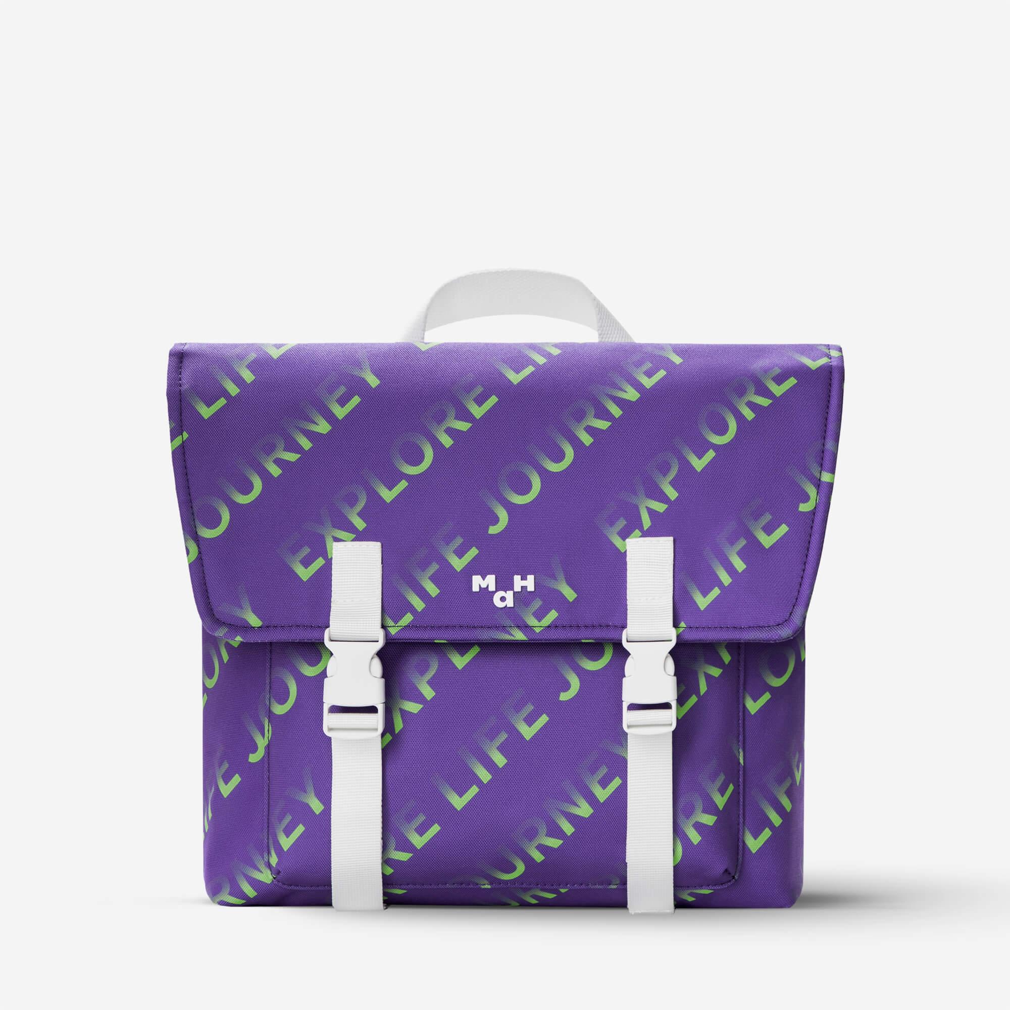 Purple backpack with green 'Explore Life Journey' print and white straps, lifestyle accessory