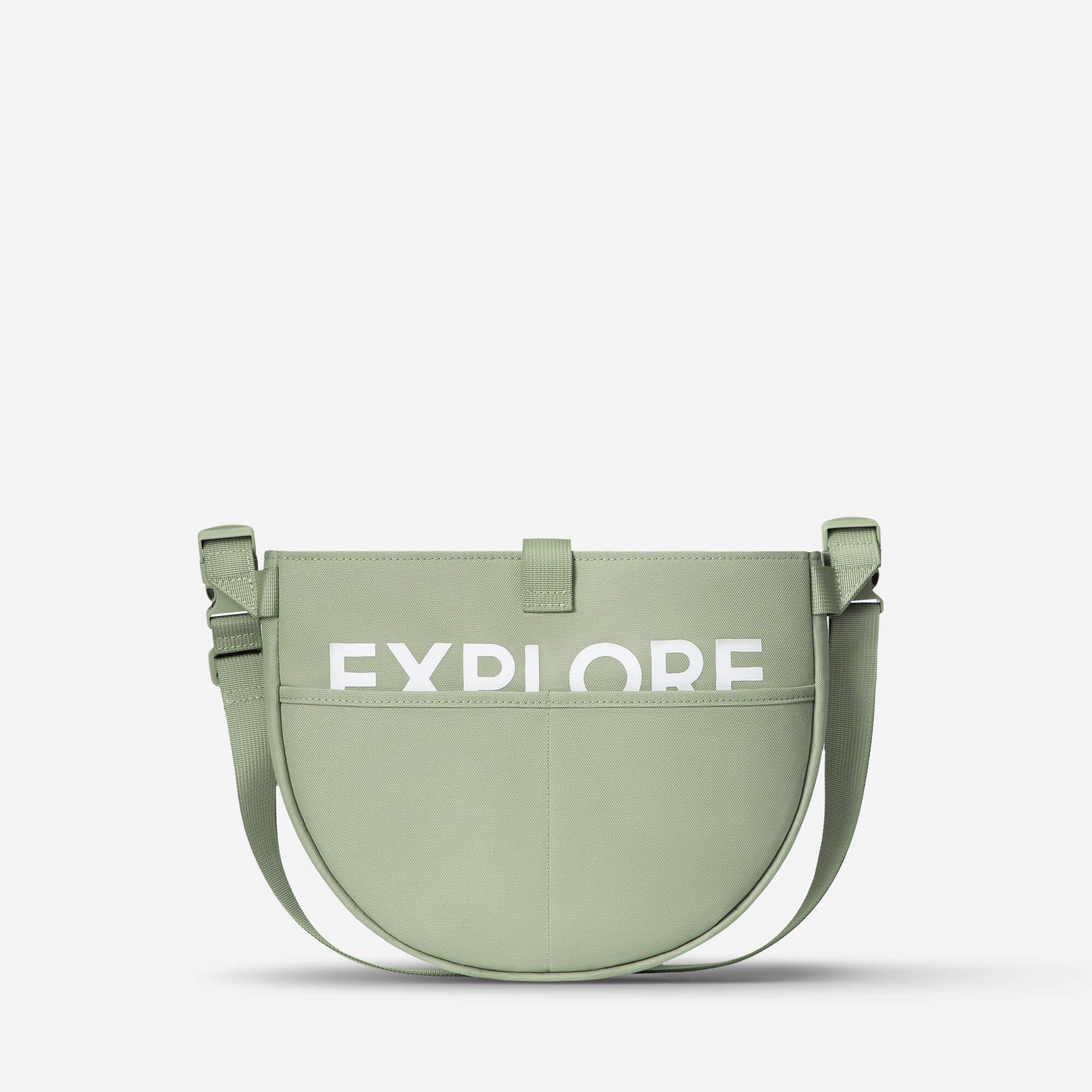Mint green crossbody bag with bold 'EXPLORE' print, ideal for travel and everyday use.