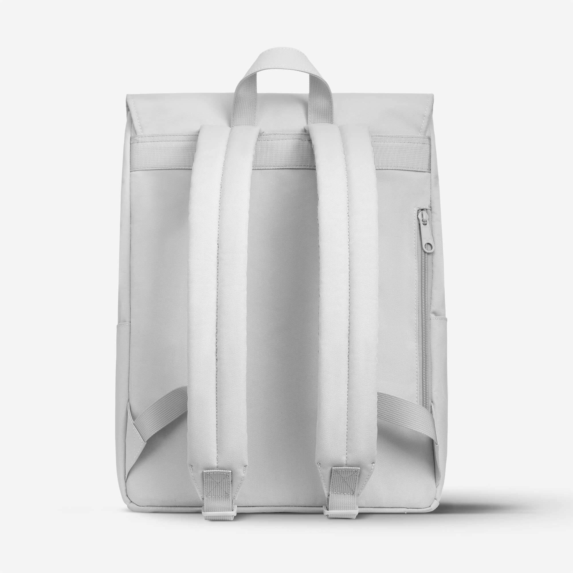 Light gray backpack with padded shoulder straps and side zip pocket, minimalist design for daily use
