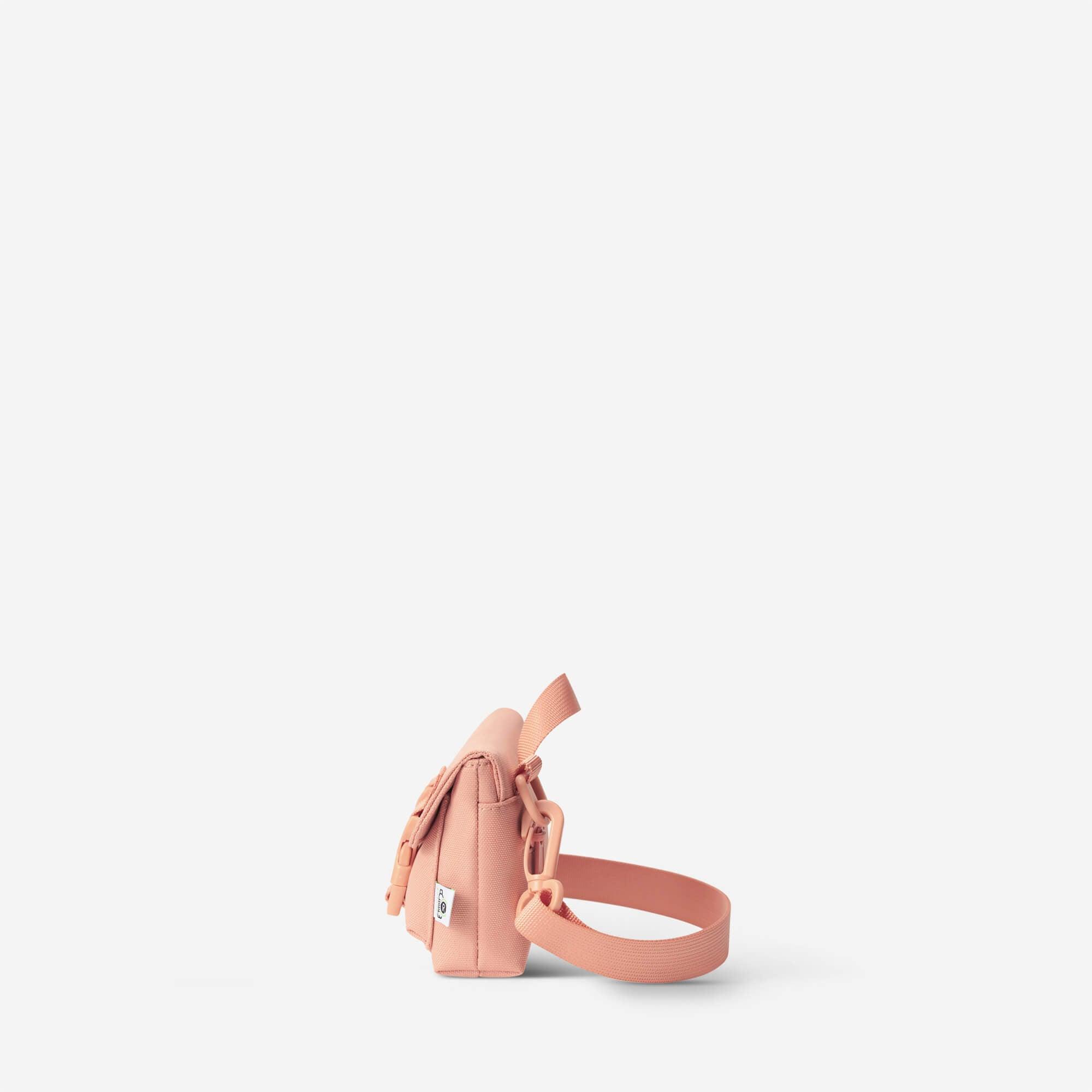Pink crossbody bag with adjustable strap, minimalist design, ideal for everyday carry and lifestyle use