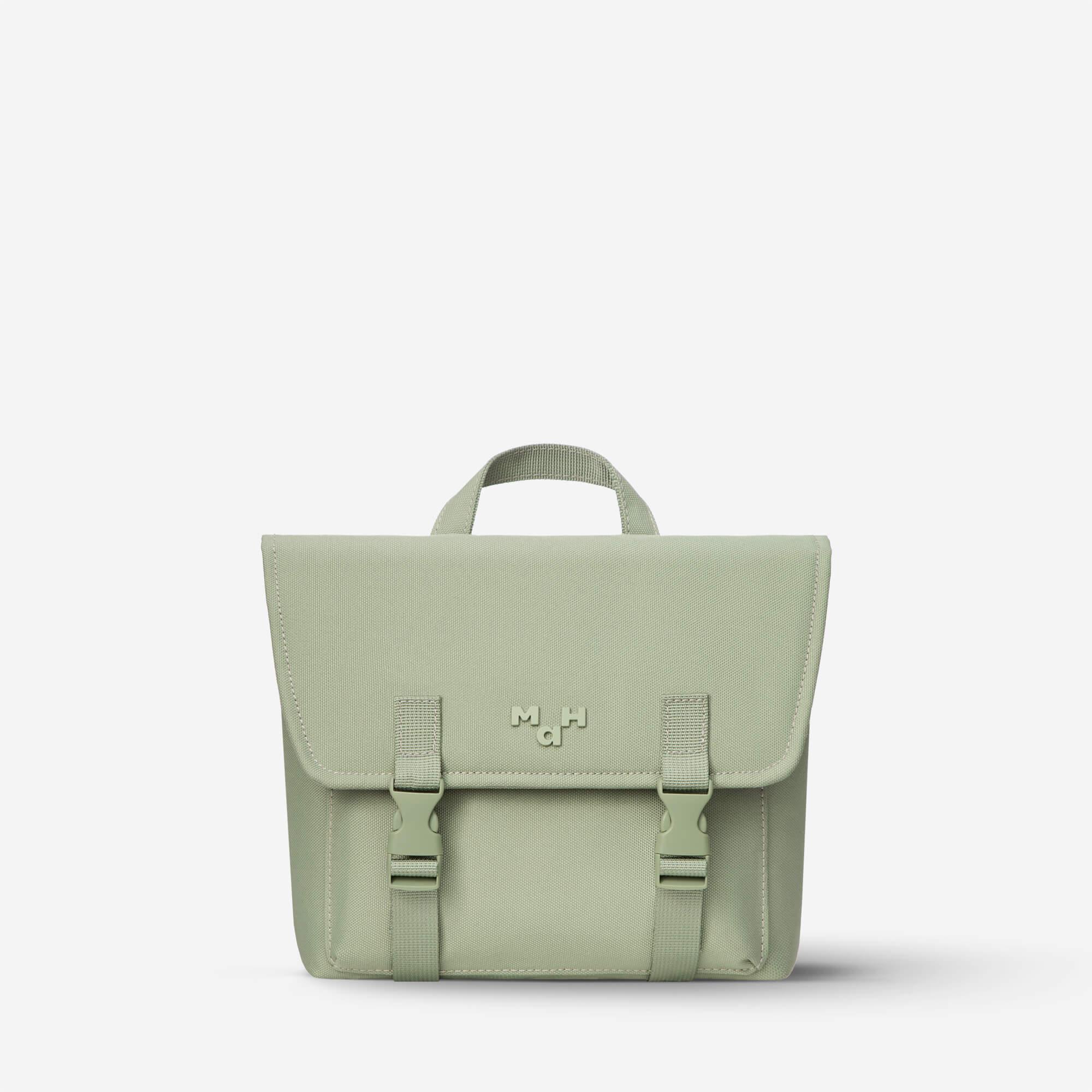 Sage green satchel bag with top handle and buckle straps, minimalist design for everyday use