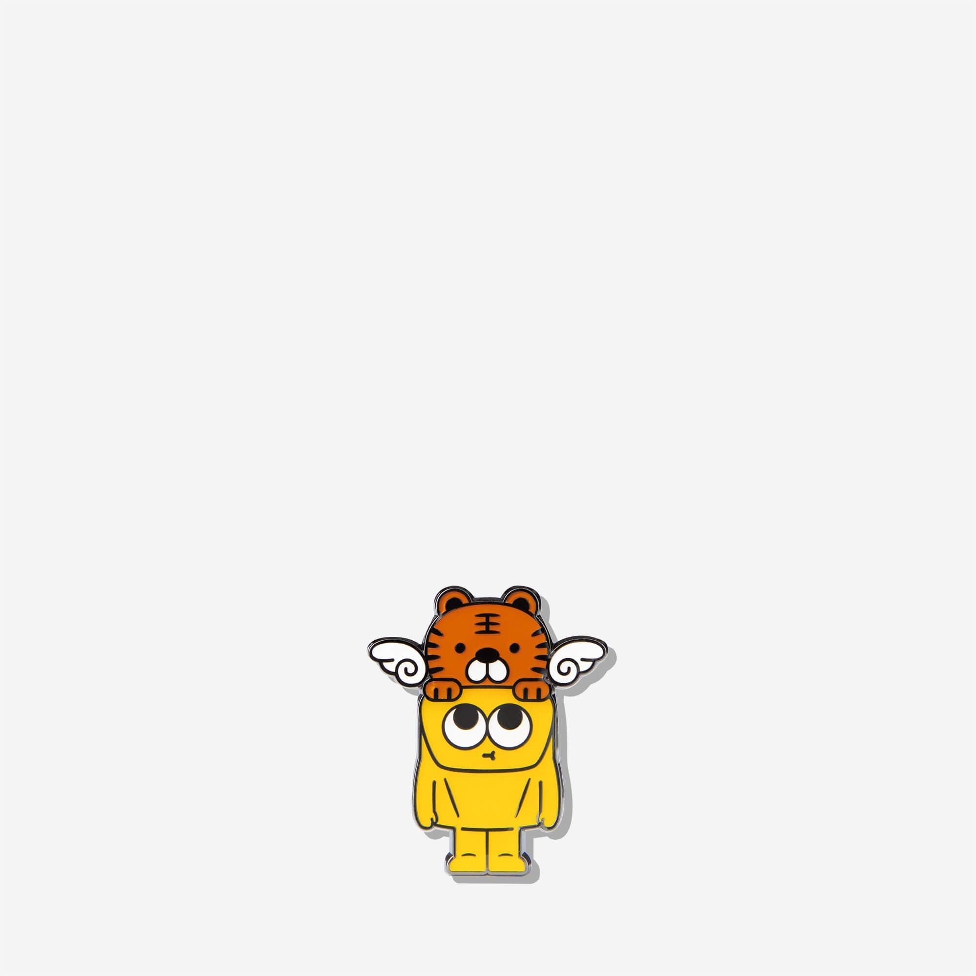Cute cartoon enamel pin featuring a yellow character with a tiger on its head and angel wings, perfect for backpacks and bags.