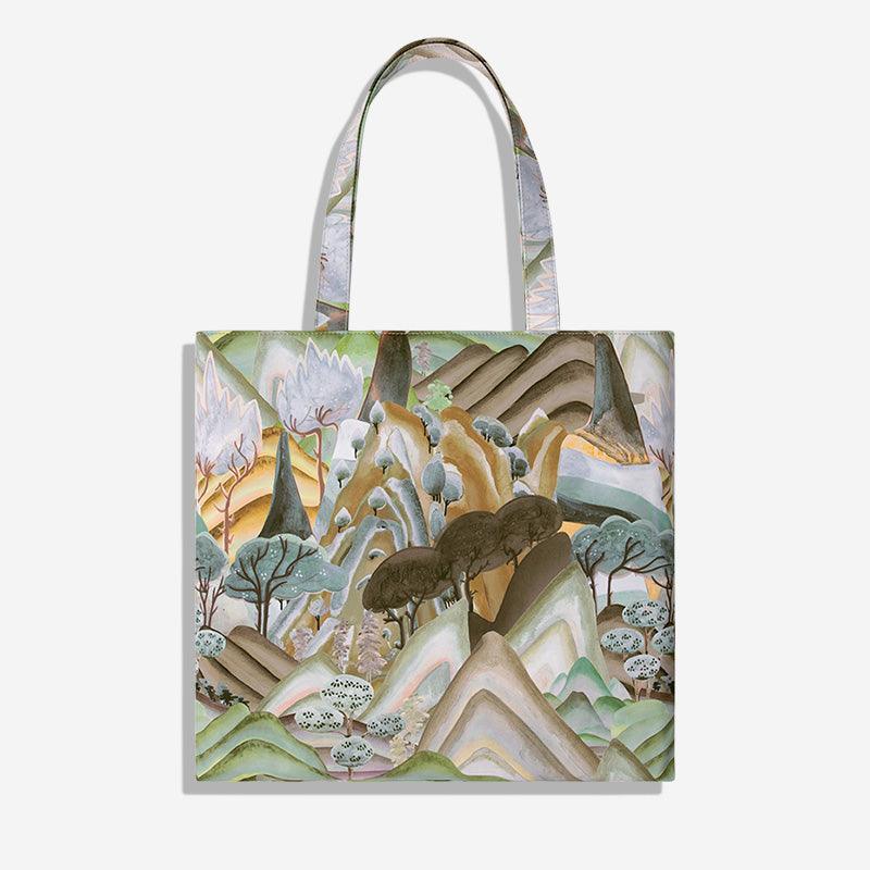 Artistic tote bag with abstract mountain landscape print, ideal for everyday use and stylish carryalls.