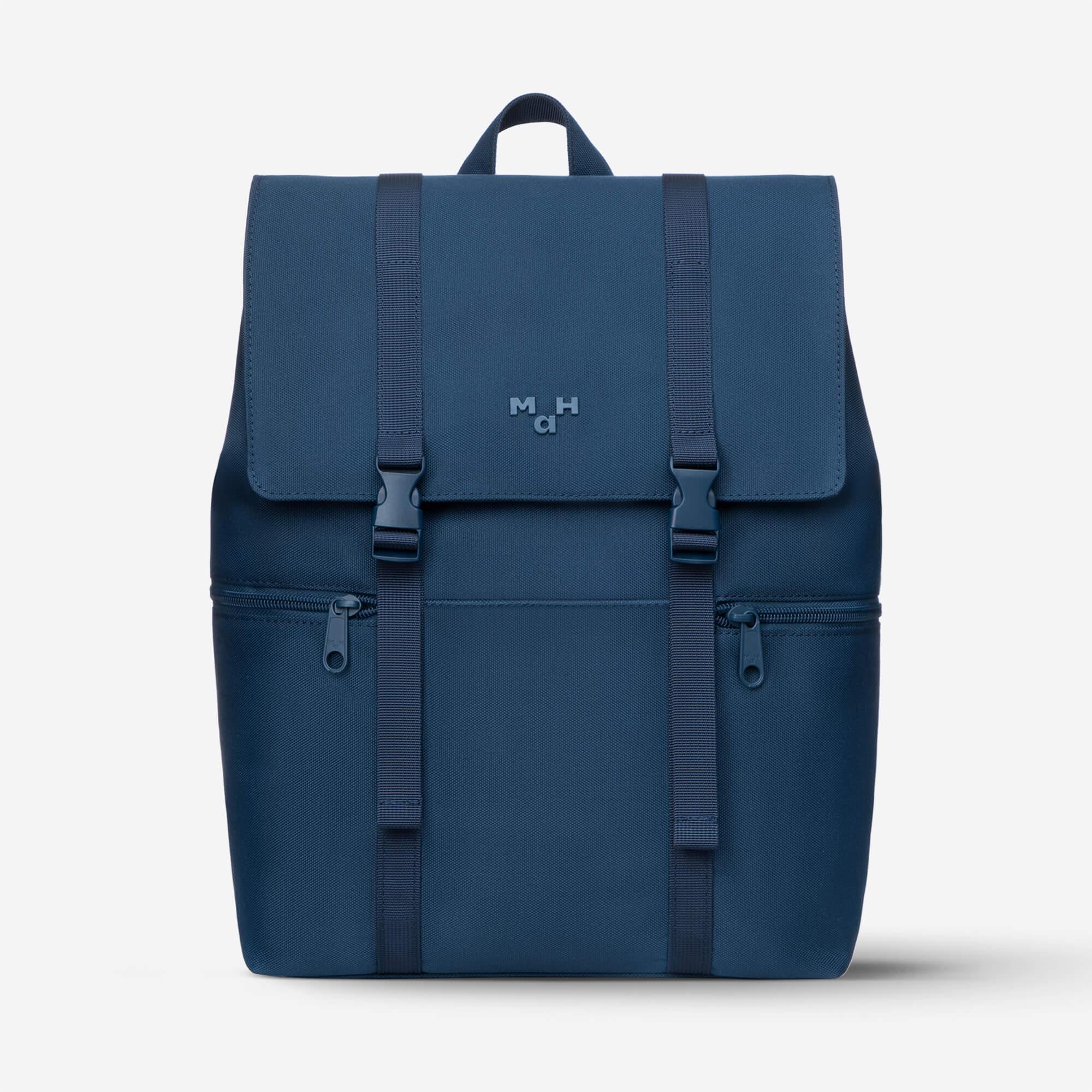 Navy blue backpack with front flap, dual straps, and side zip pockets for daily use