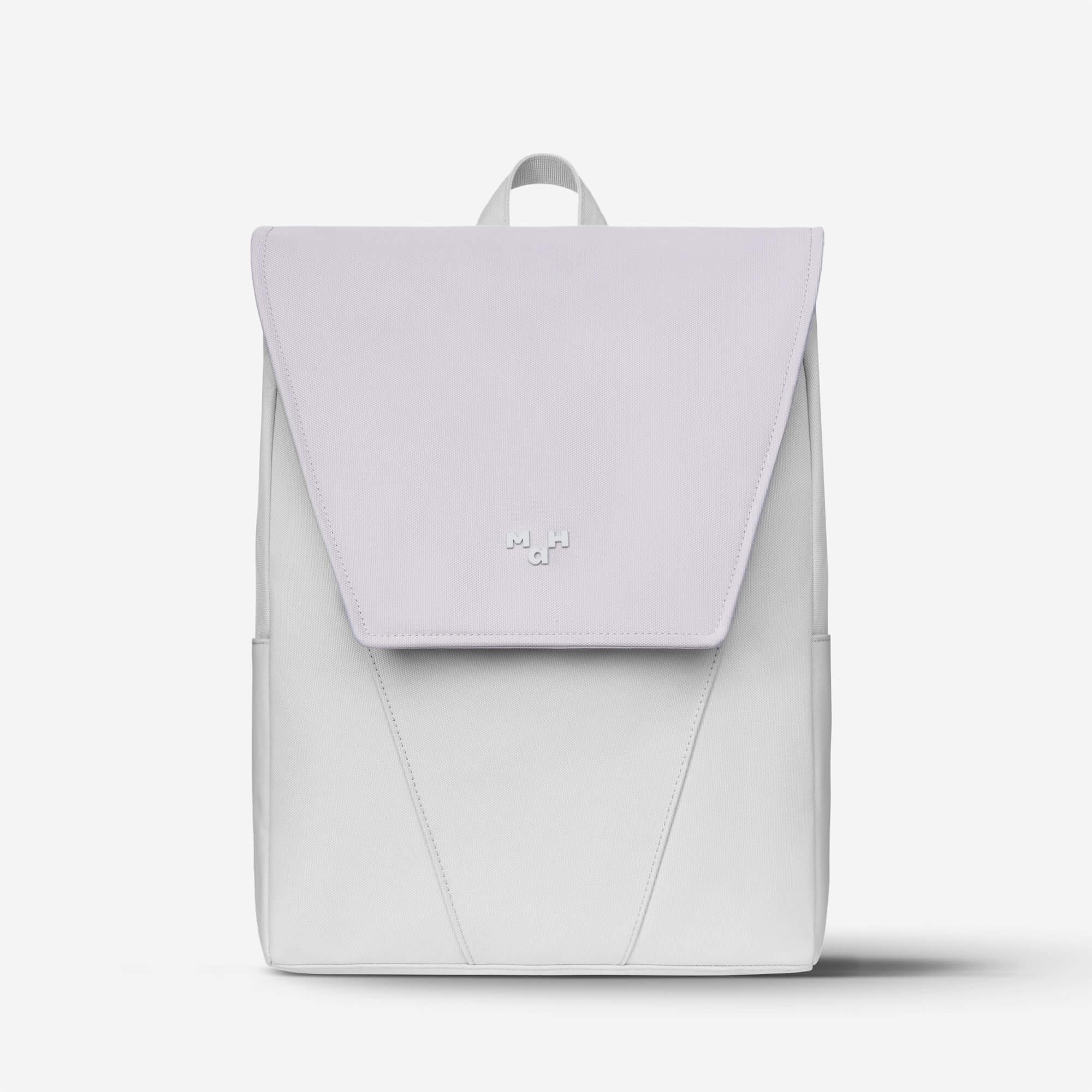 Minimalist white backpack with flap closure and subtle logo, ideal for daily use or travel