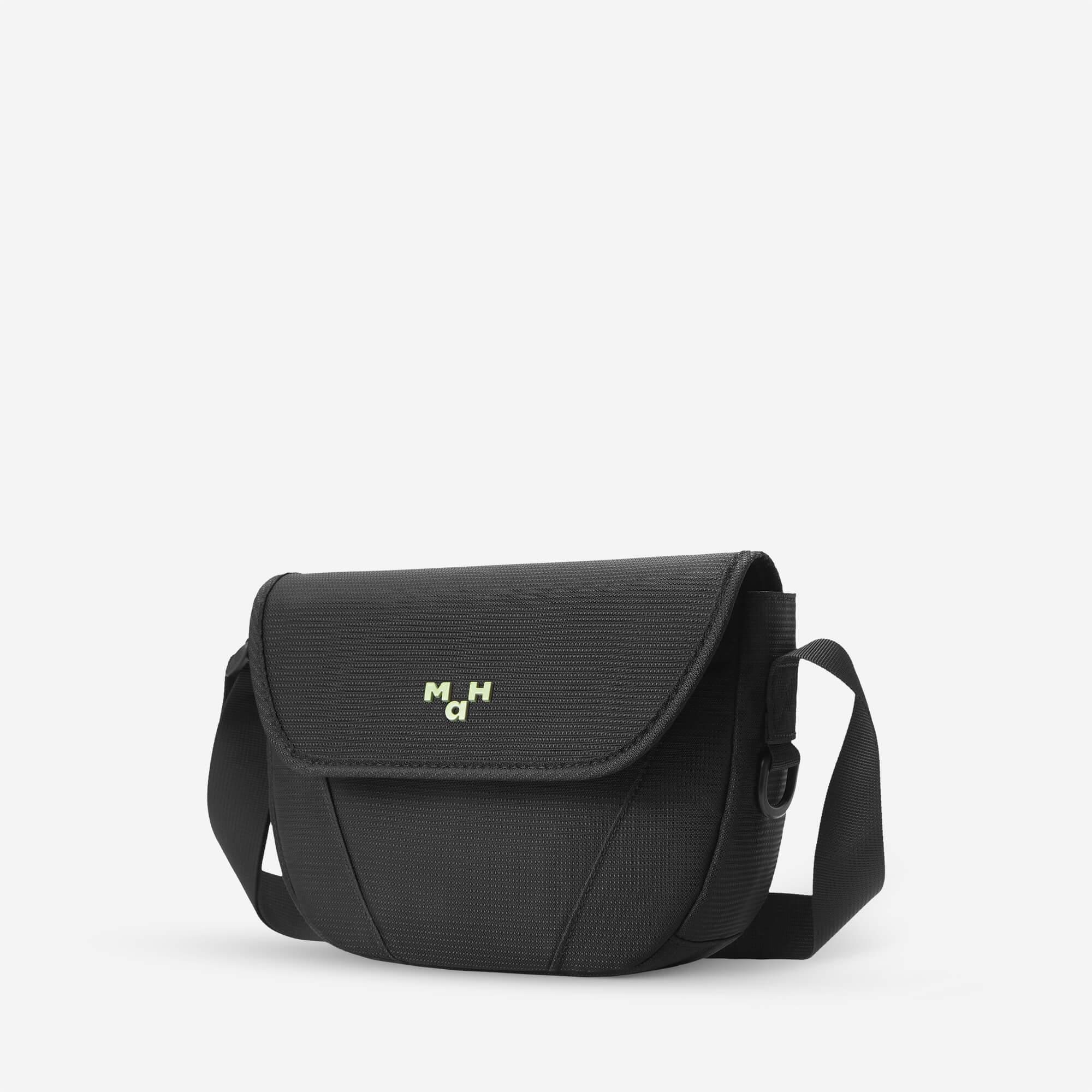 Black crossbody bag with adjustable strap and subtle logo, ideal for everyday carry and urban style.