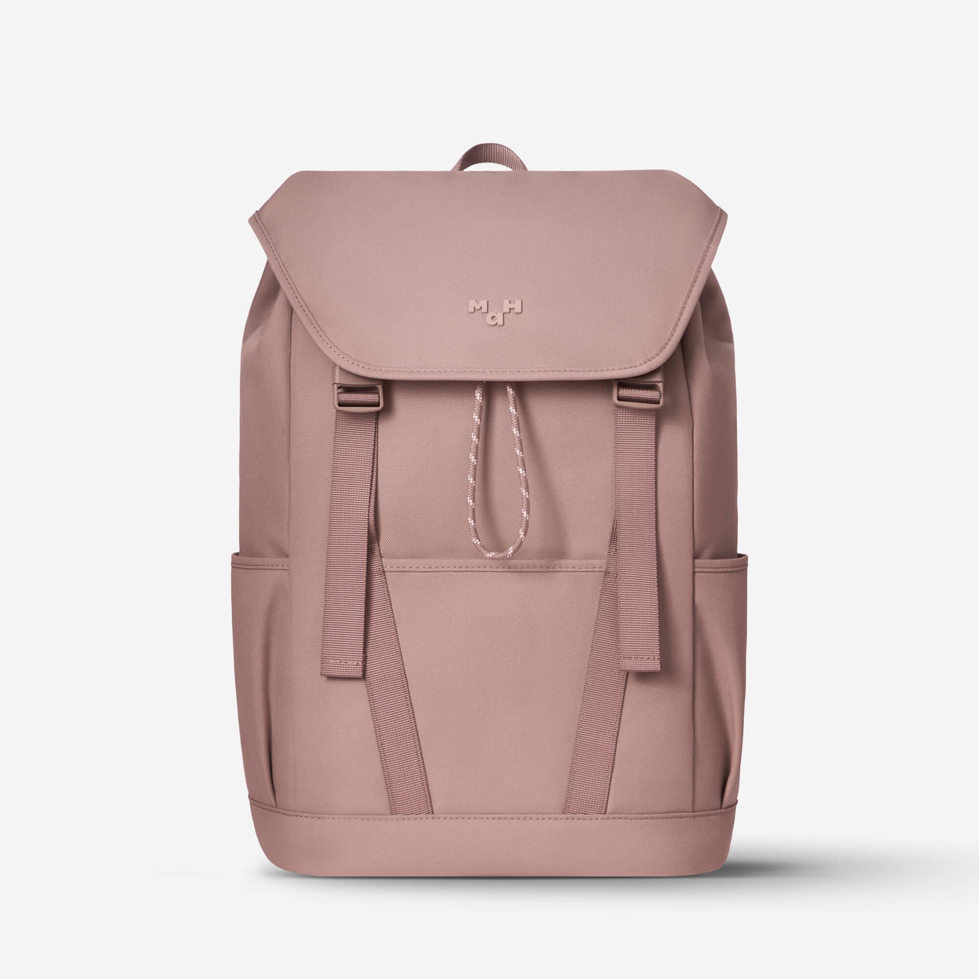 Dusty rose backpack with front flap, drawstring closure, and side pockets, ideal for daily use or travel.