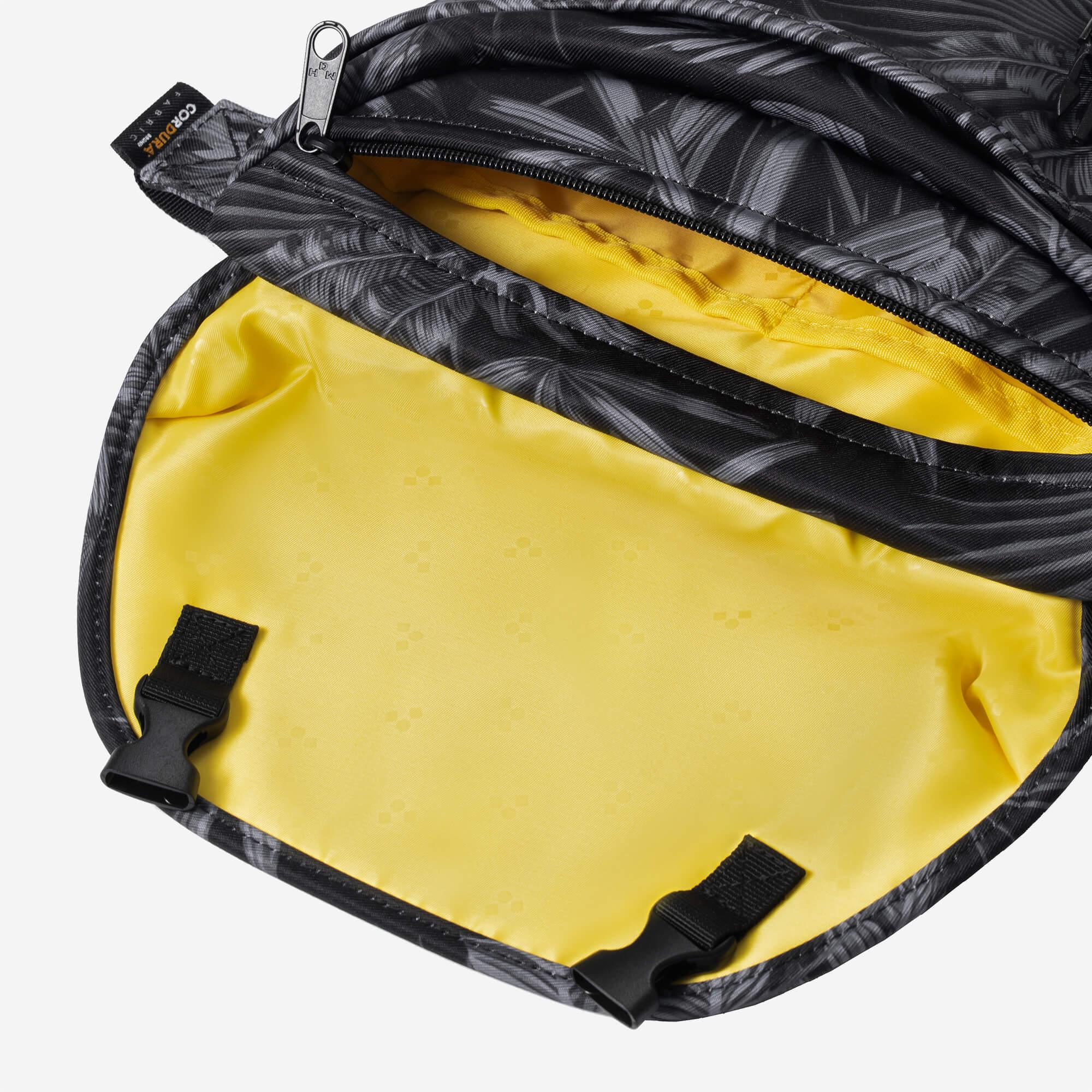Black patterned bag with yellow interior, Cordura fabric, and zippered compartments for everyday carry.