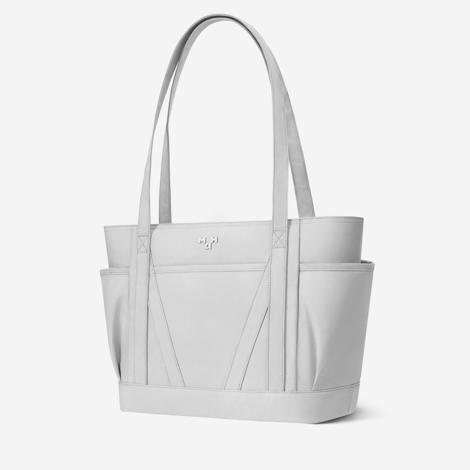 Light gray tote bag with side pockets and logo, ideal for everyday use and travel