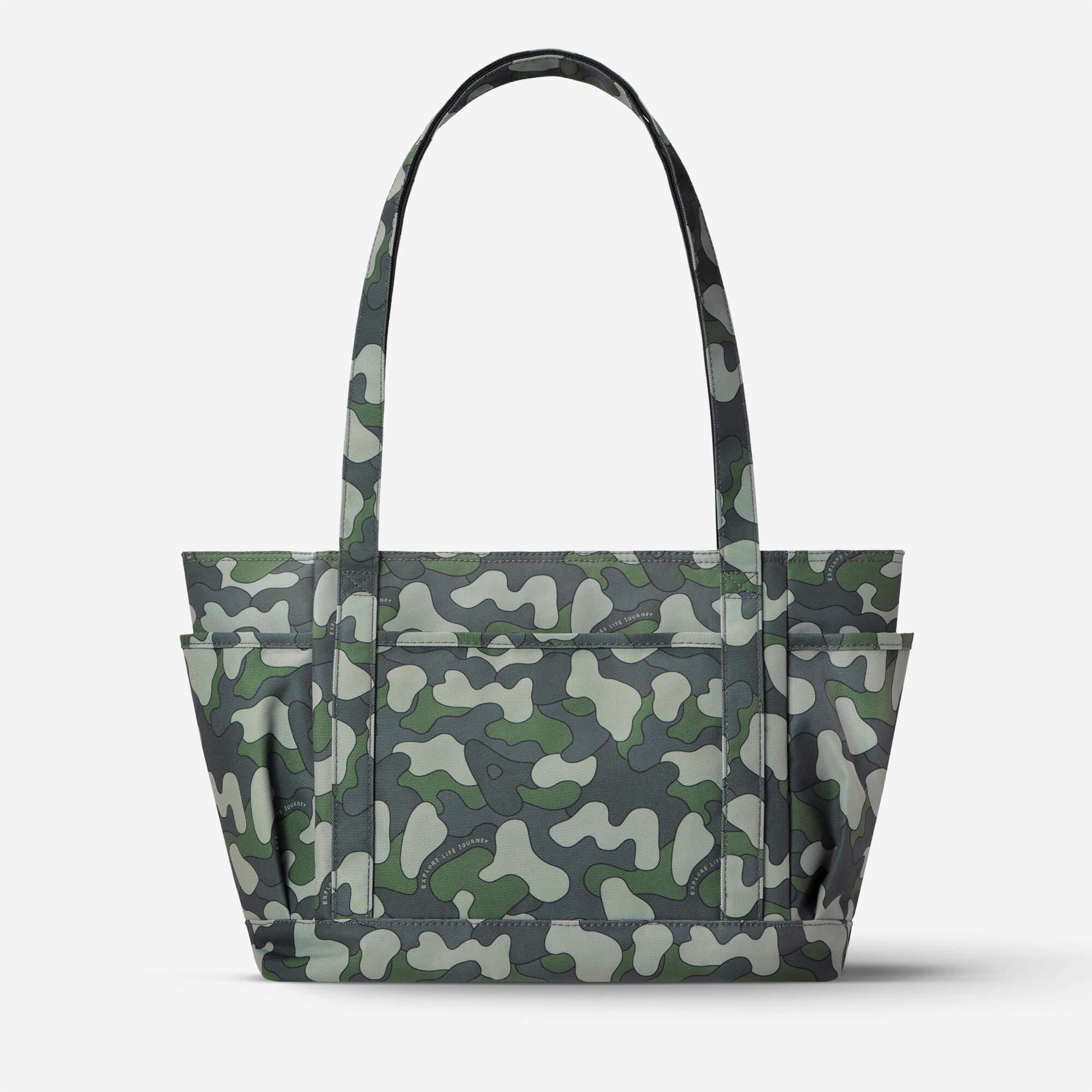 Camouflage tote bag with green, gray, and white pattern, featuring side pockets and sturdy handles for everyday use.