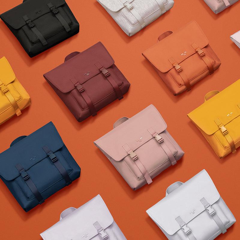 Colorful minimalist backpacks with buckle straps, stylish design for everyday use