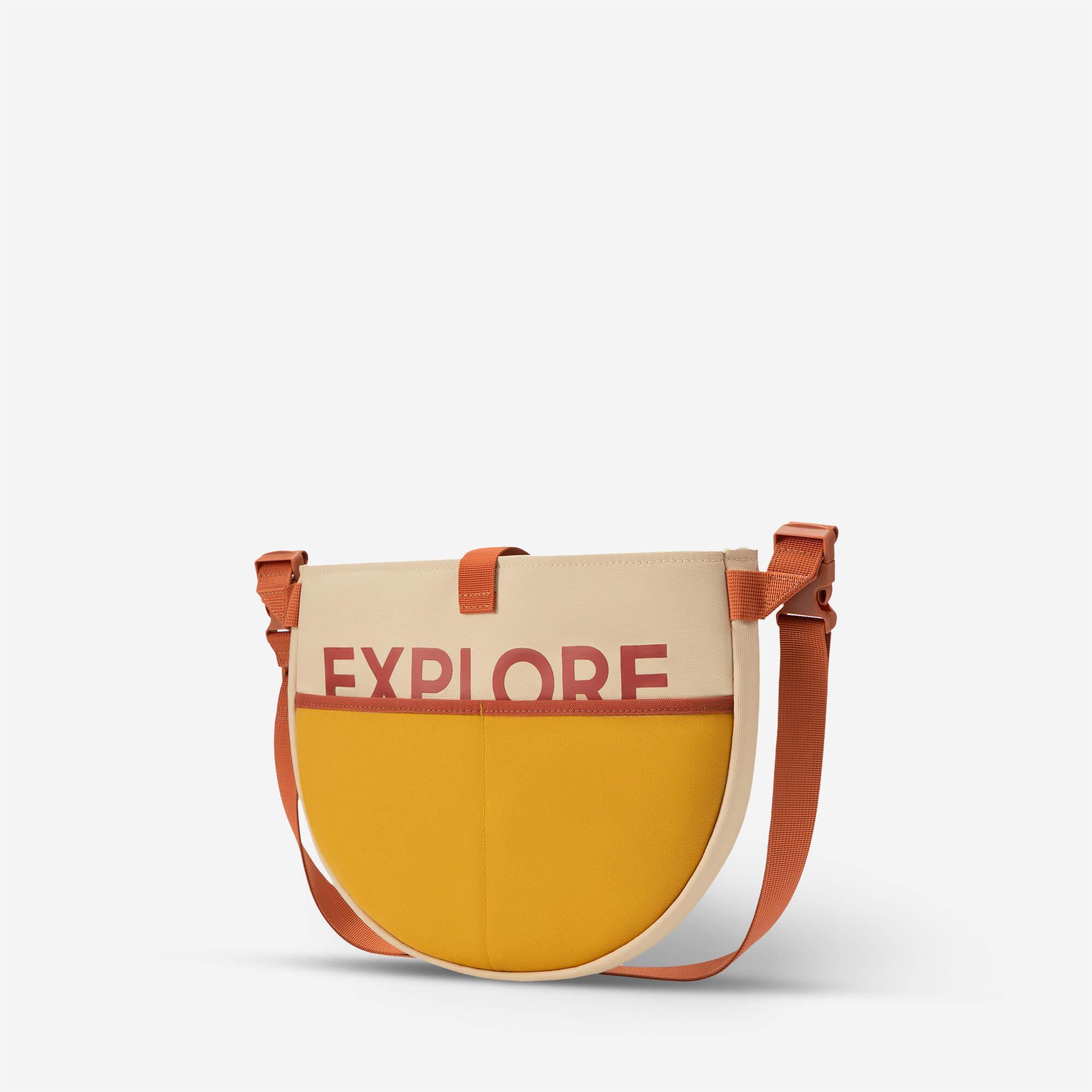 Explore print crossbody bag with yellow and beige panels, adjustable strap for everyday use
