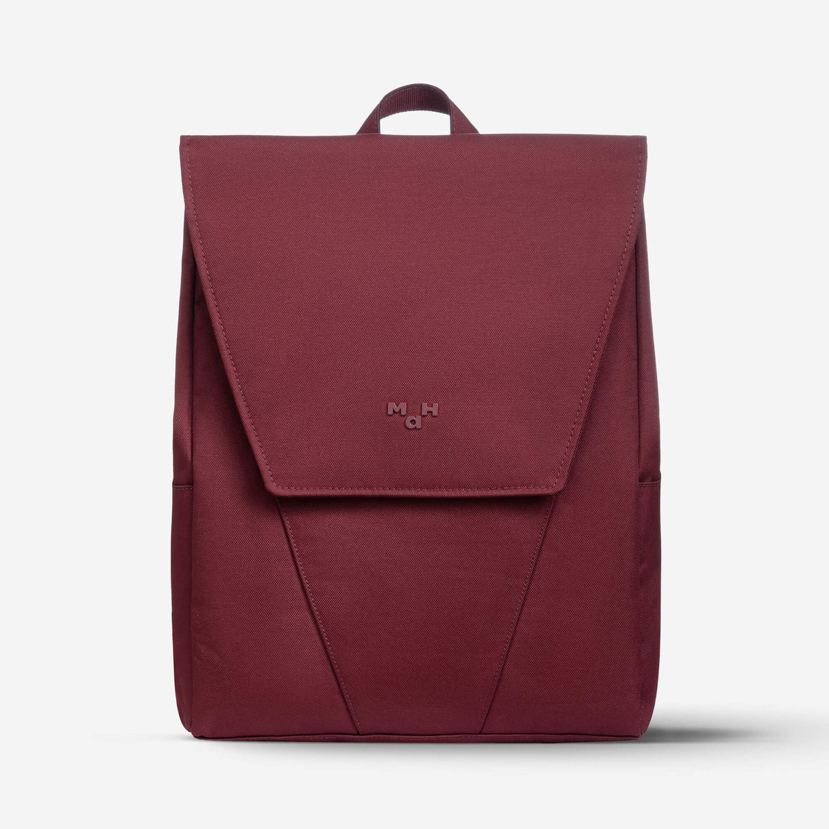 Burgundy minimalist backpack with flap closure and subtle logo, ideal for daily use or travel
