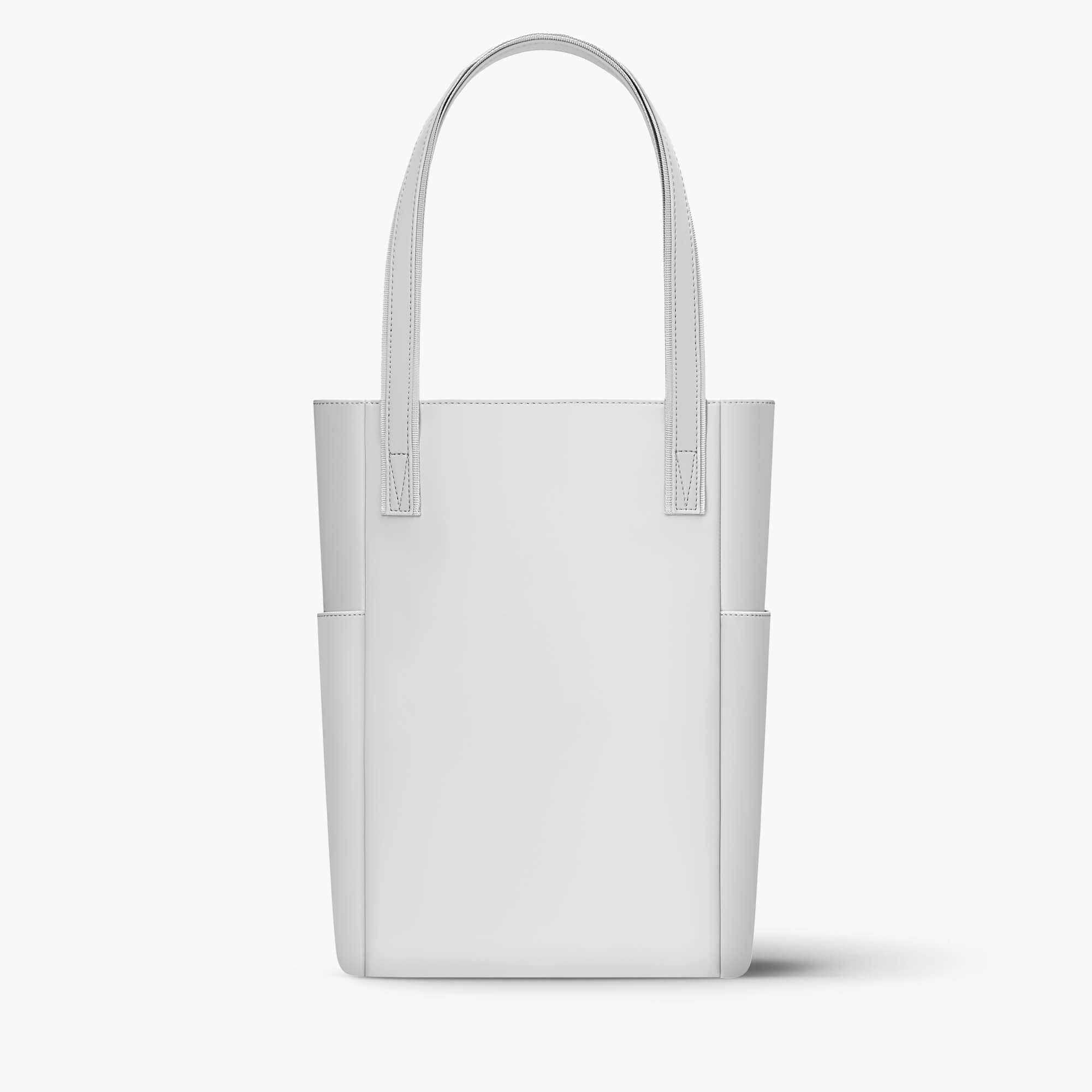 Minimalist white leather tote bag with side pockets and stitched handles for everyday use