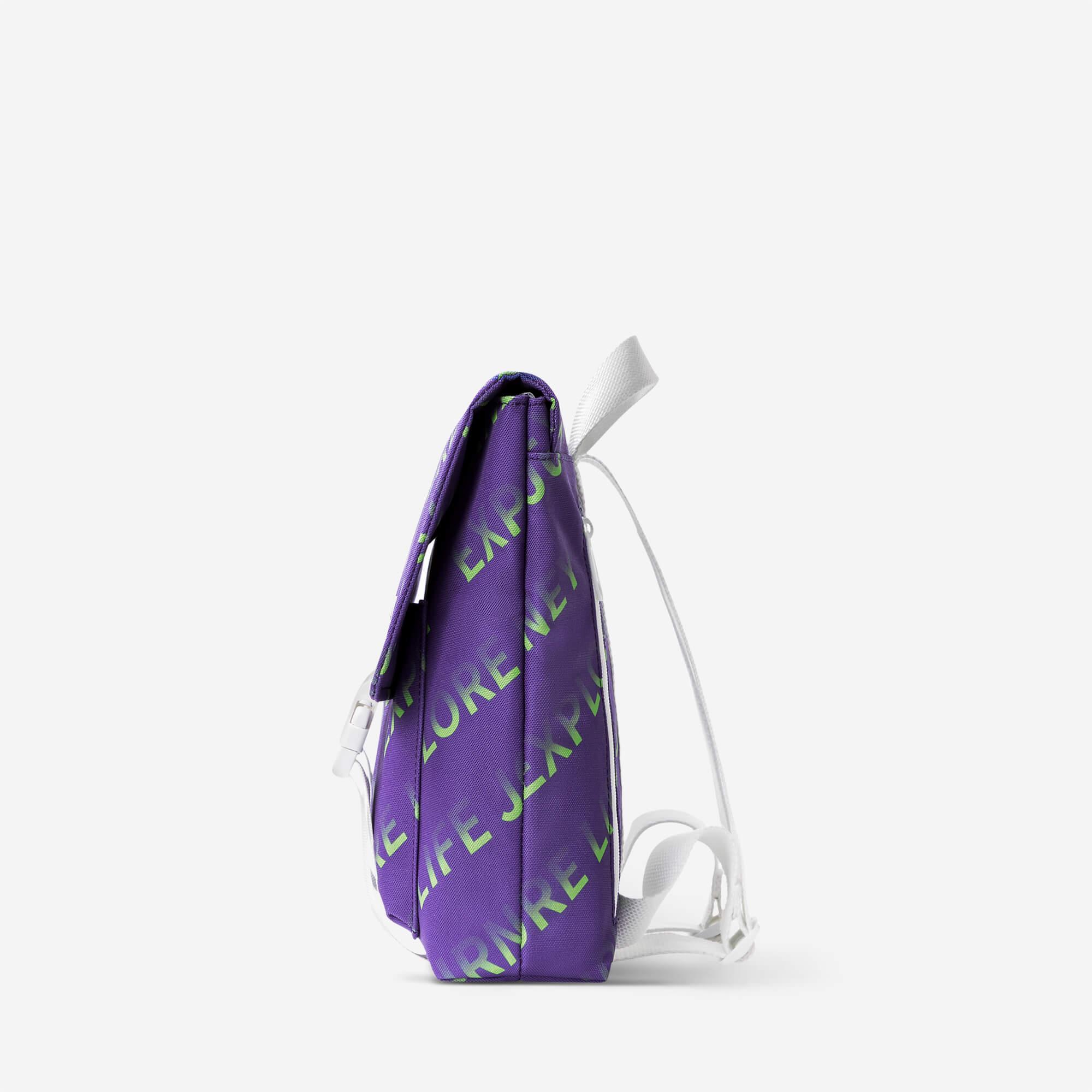 Purple backpack with neon green 'EXPLORE LIFE JOURNEY' print and white straps, side view