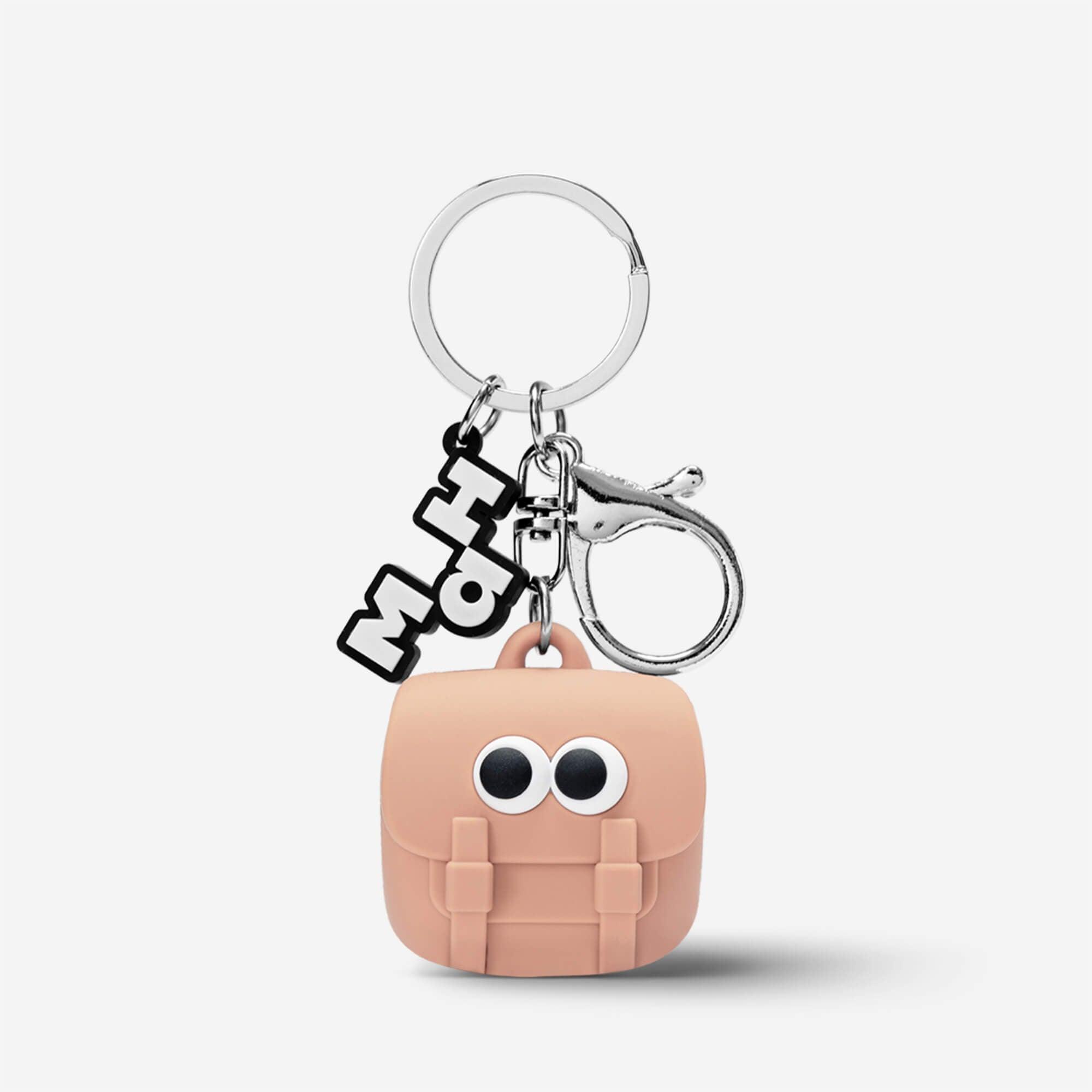 Cute pink backpack keychain with googly eyes and MH charm, fun accessory for bags or keys