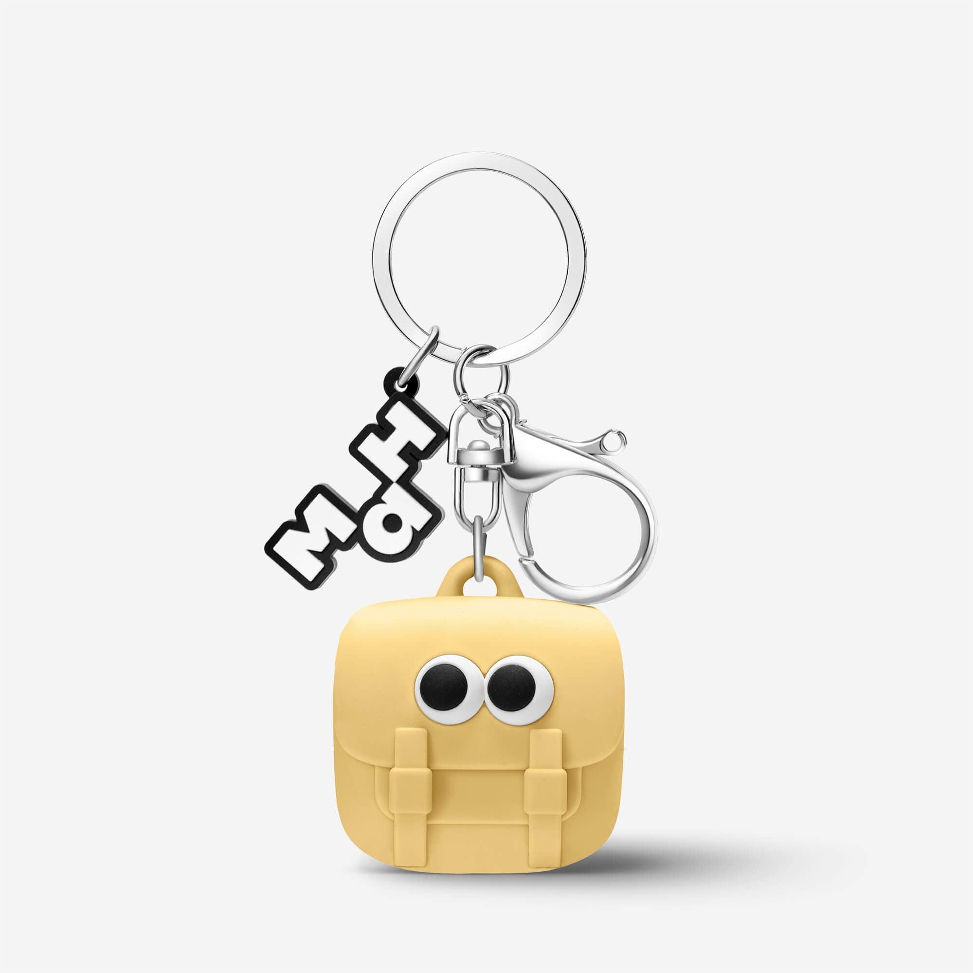 Cute yellow backpack keychain with googly eyes and silver ring, fun accessory for bags or keys