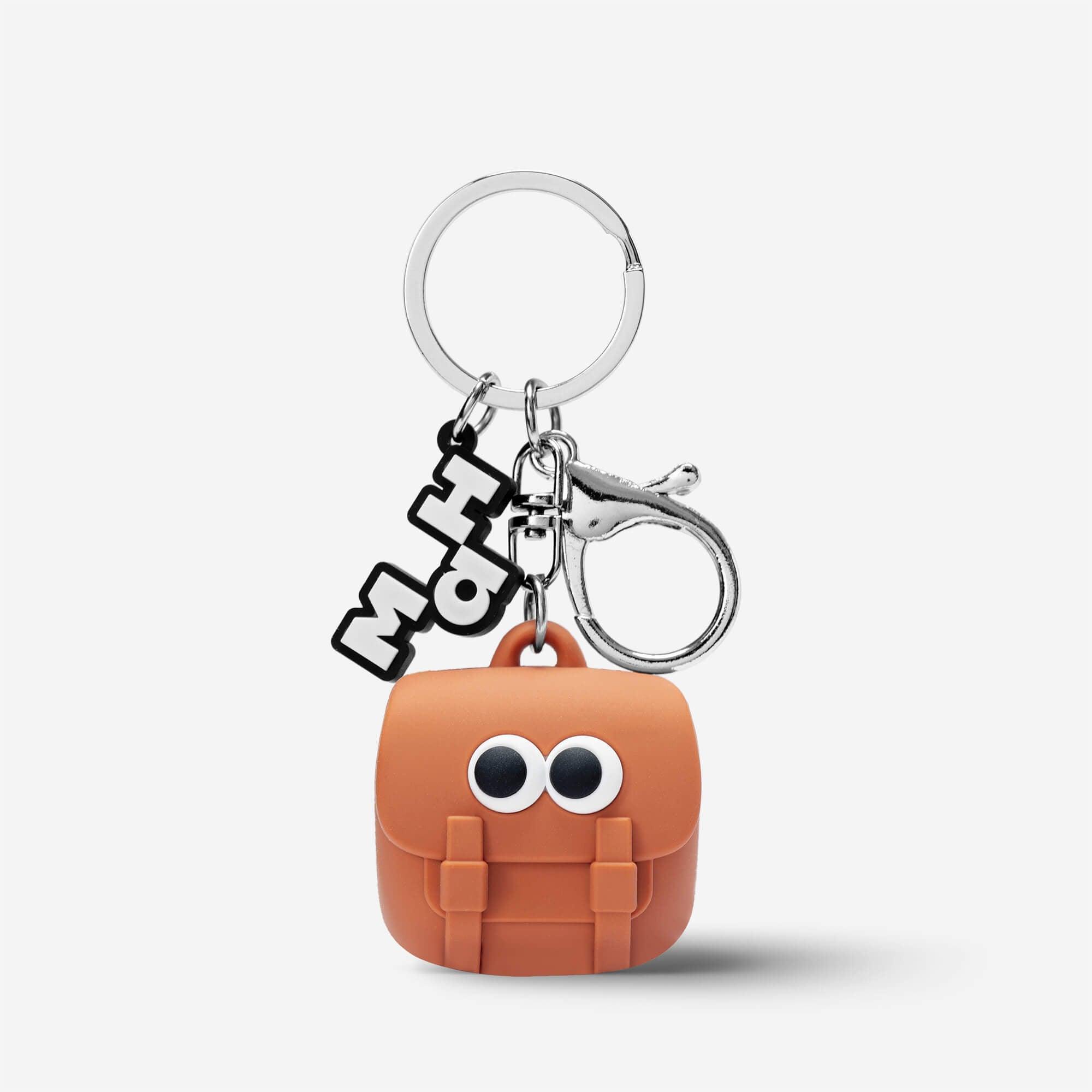 Cute orange backpack keychain with googly eyes and MaH charm, fun accessory for bags or keys
