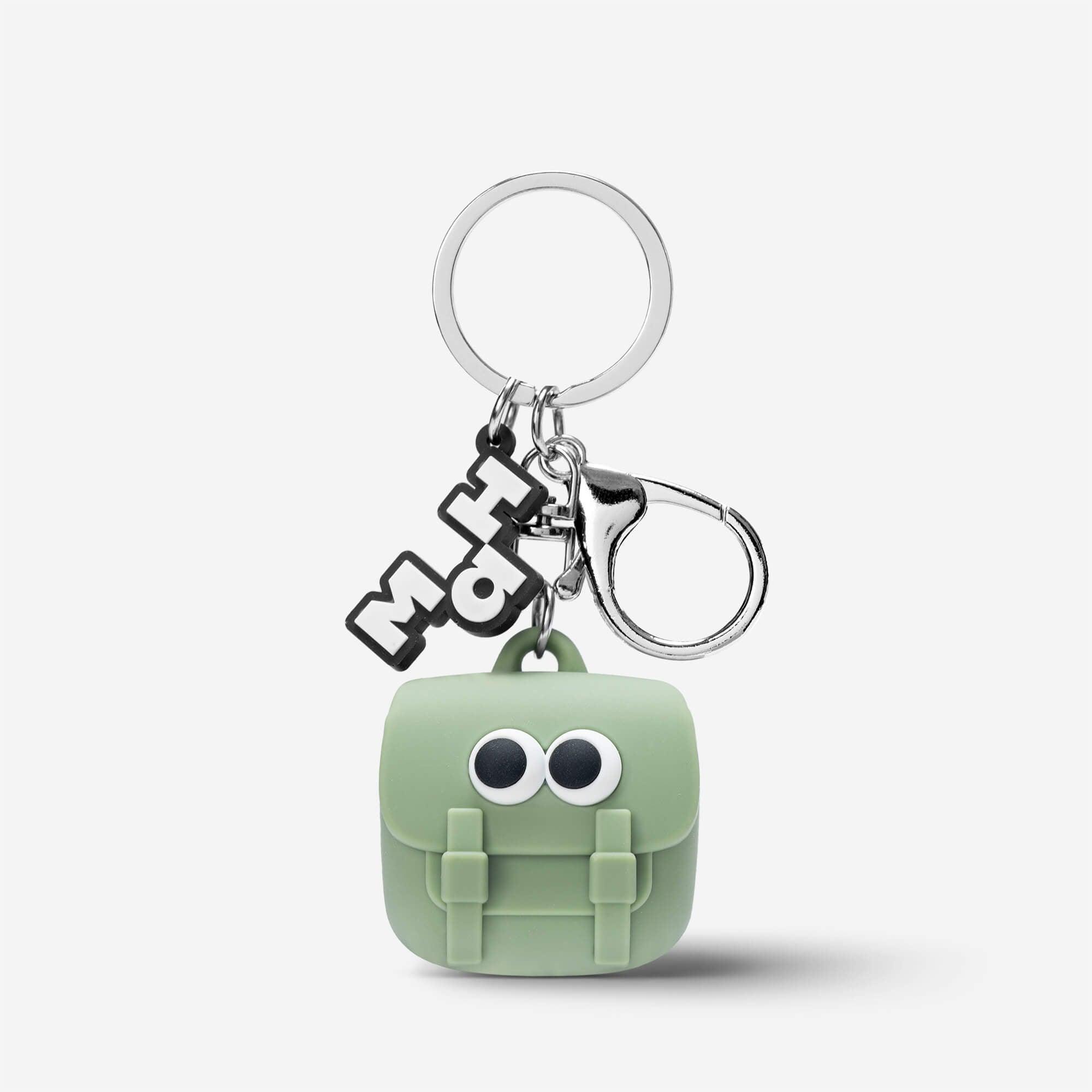 Cute green backpack keychain with googly eyes and MaH logo charm, fun accessory for bags or keys