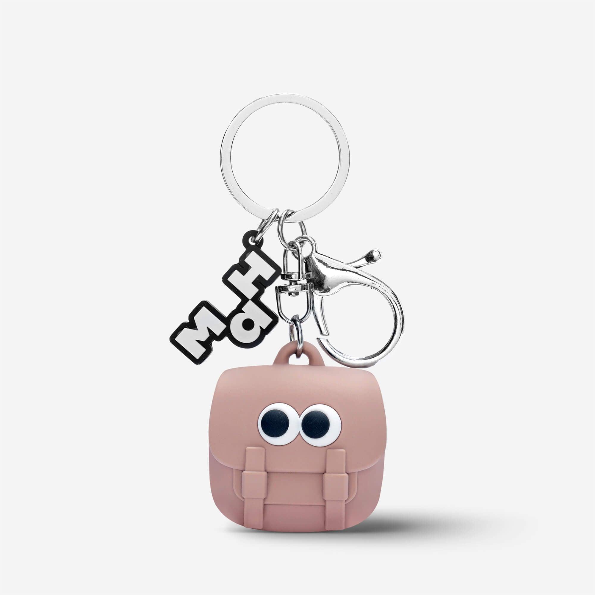 Cute pink backpack keychain with googly eyes, silver ring, and MH charm for bags and accessories