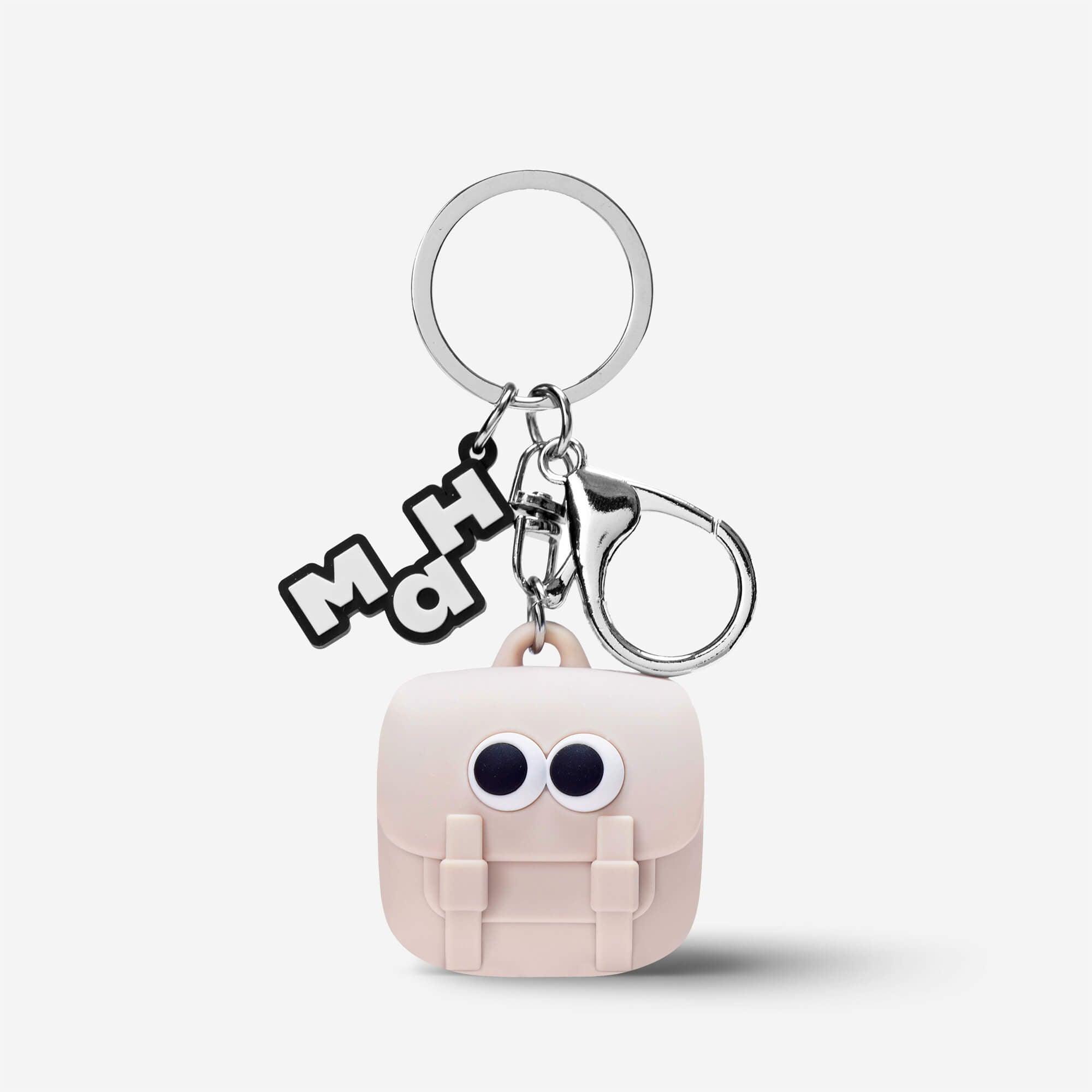 Cute pink backpack keychain with googly eyes and MH charm, fun accessory for bags or keys