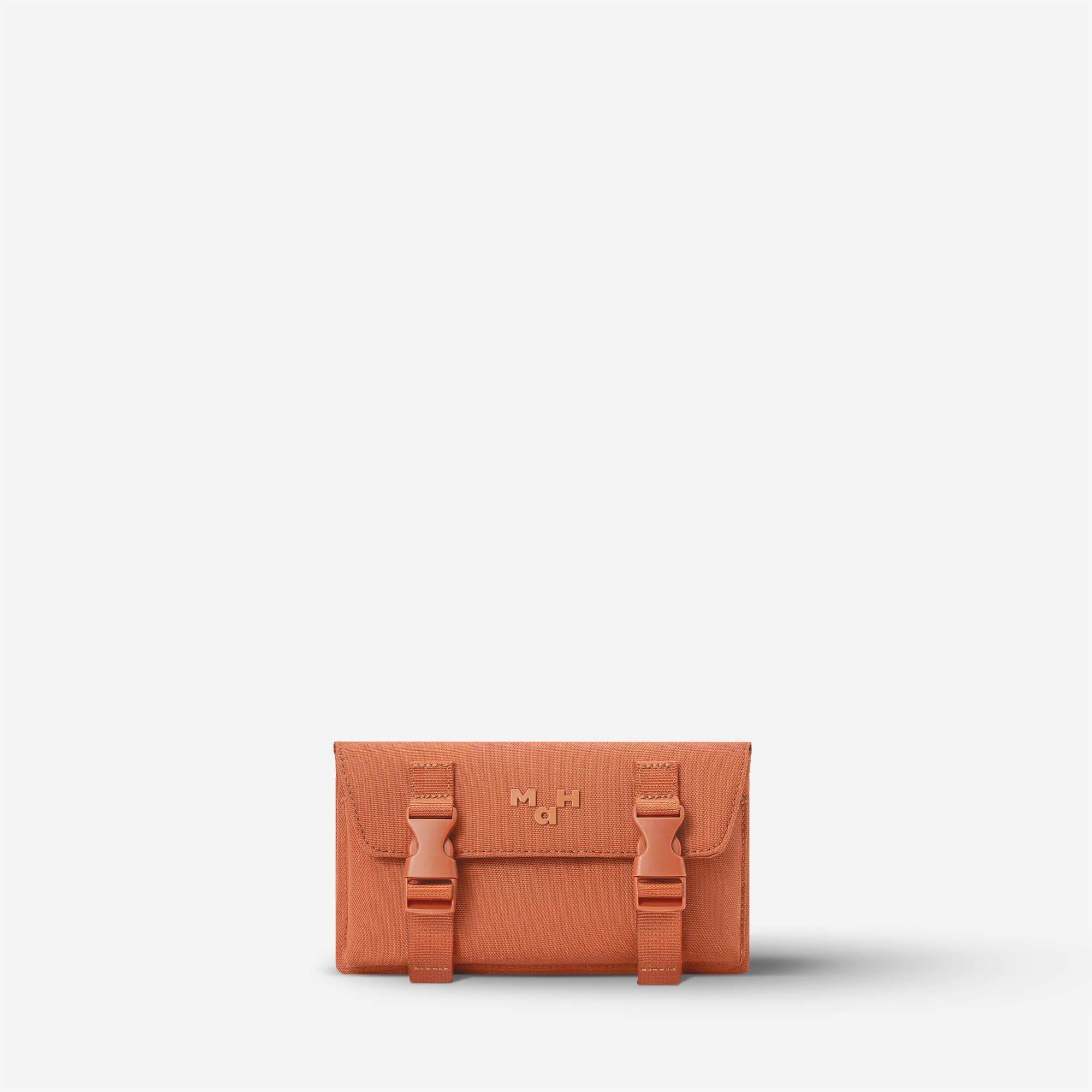 Terracotta canvas wallet with buckle straps and MaH logo, minimalist design for everyday use