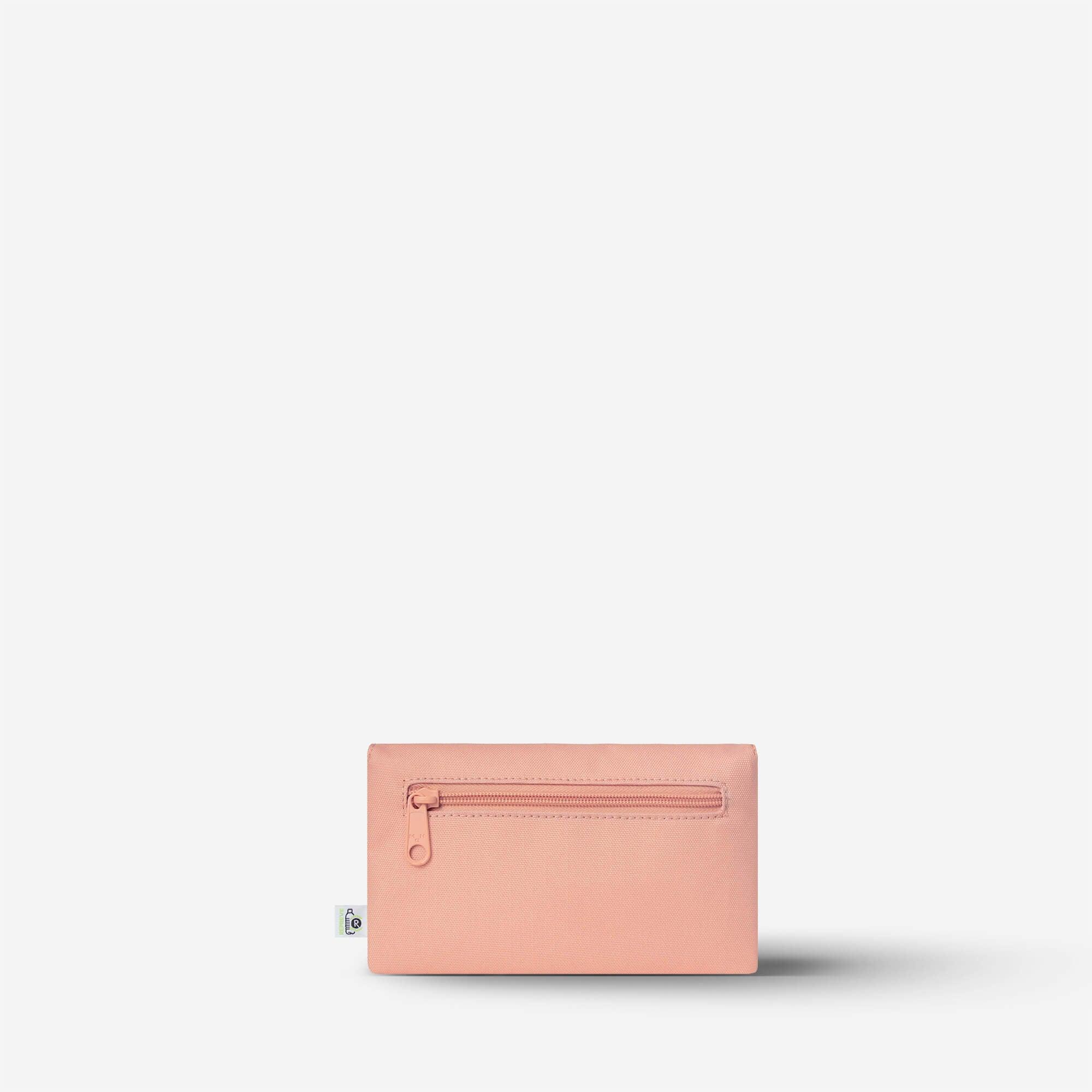 Pink zippered pouch with minimalist design, ideal for accessories or small essentials