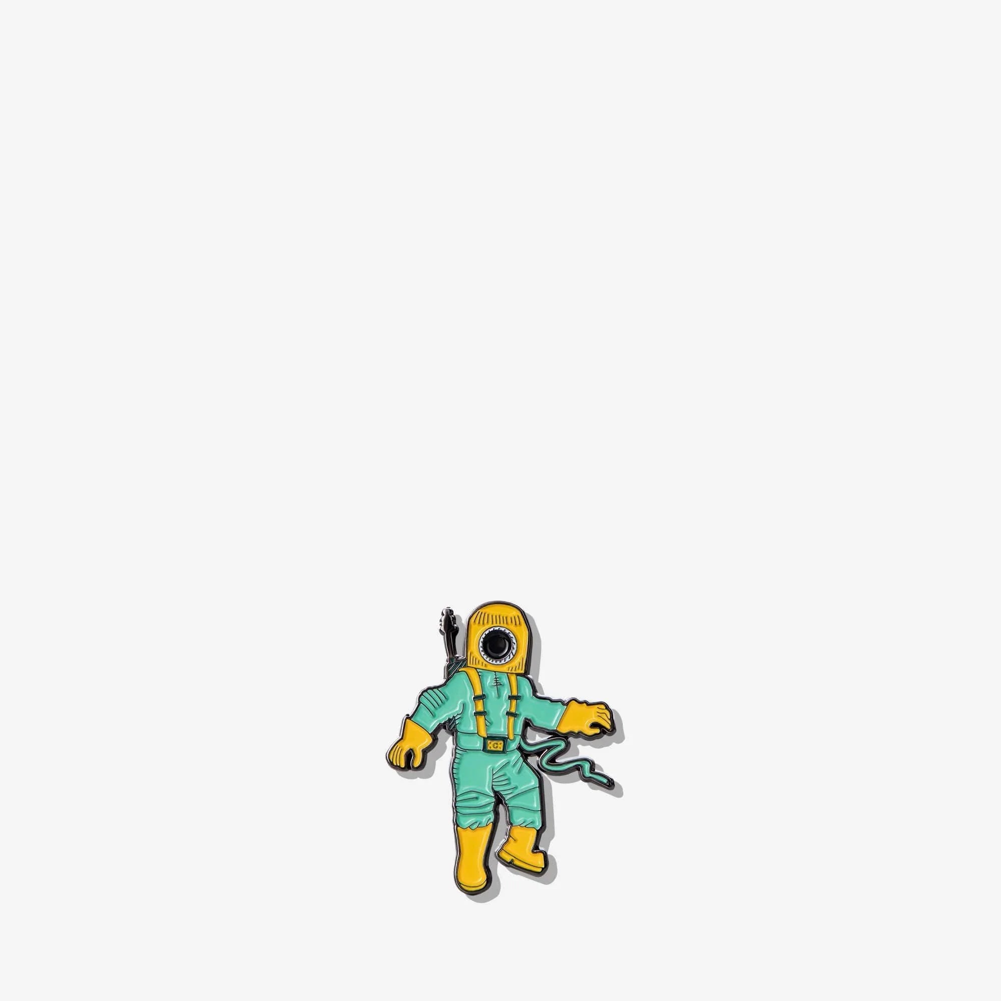 Enamel pin of astronaut in teal suit with yellow helmet and boots, holding guitar, for bags and accessories