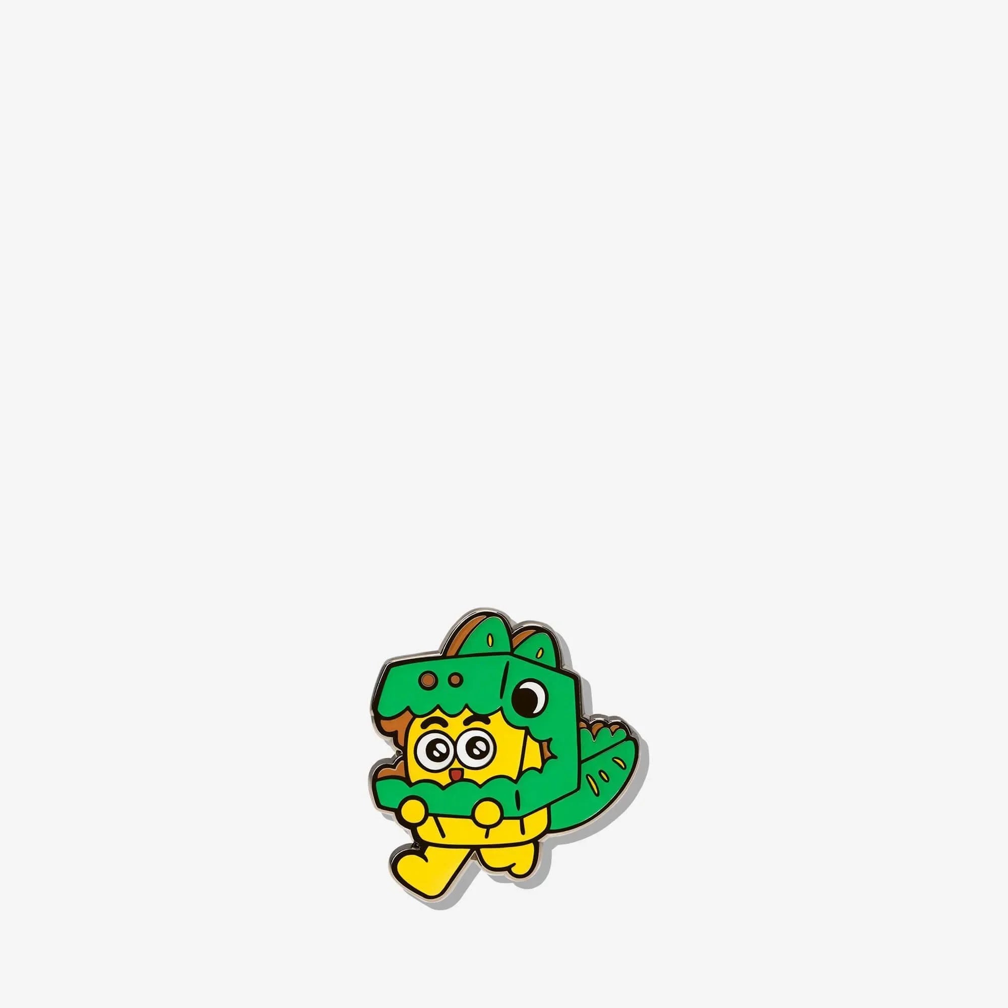 Cute yellow character in green dinosaur costume enamel pin, fun accessory for bags or jackets