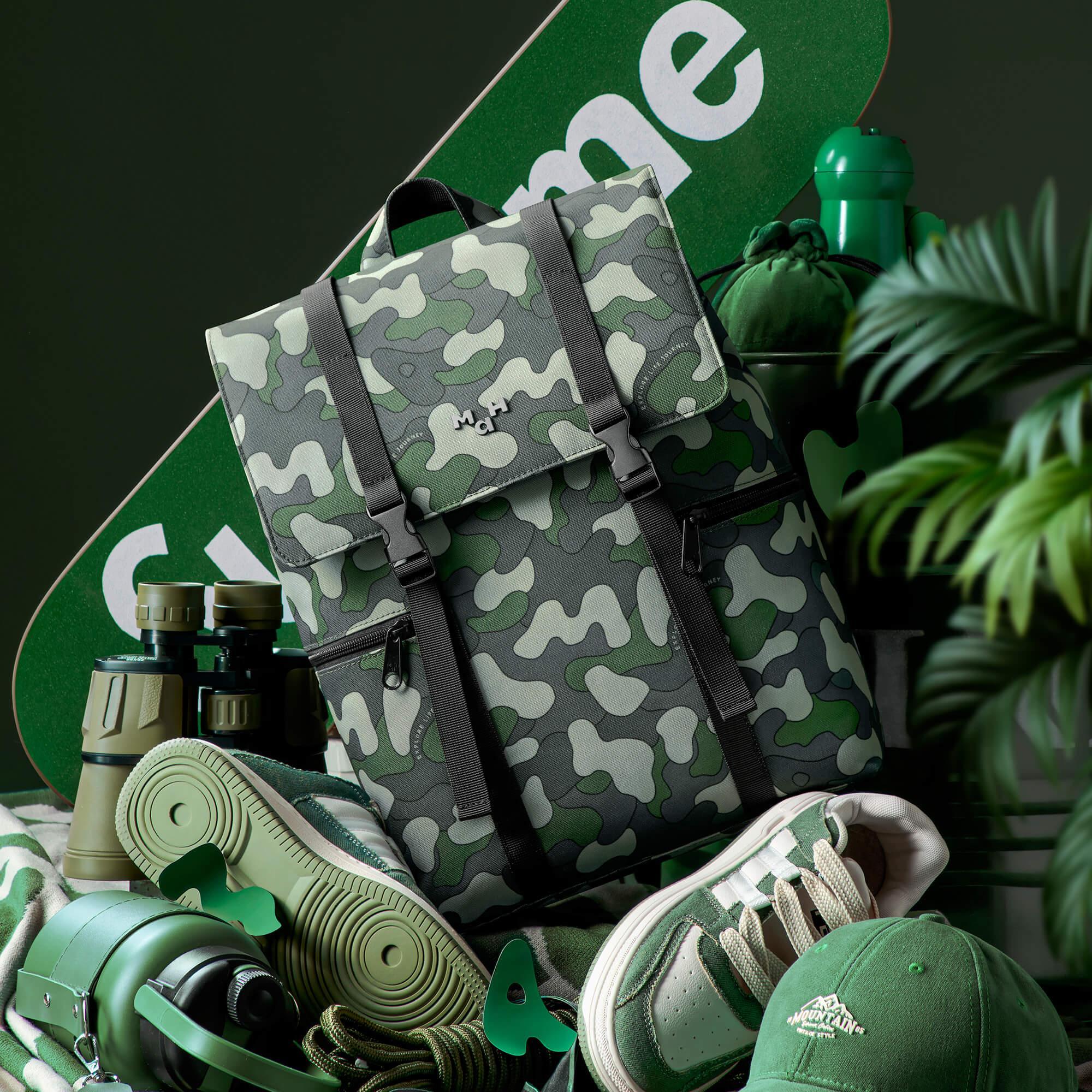 Camouflage backpack with green sneakers, binoculars, and outdoor gear for adventure lifestyle