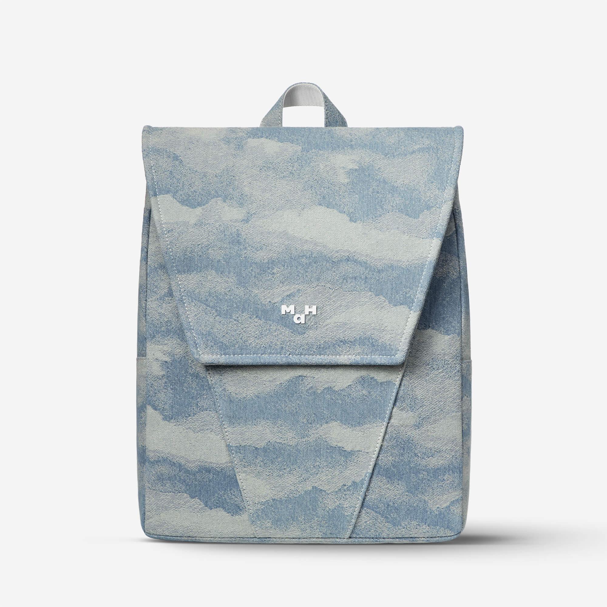 Blue cloud-patterned backpack with flap closure and top handle, ideal for everyday use