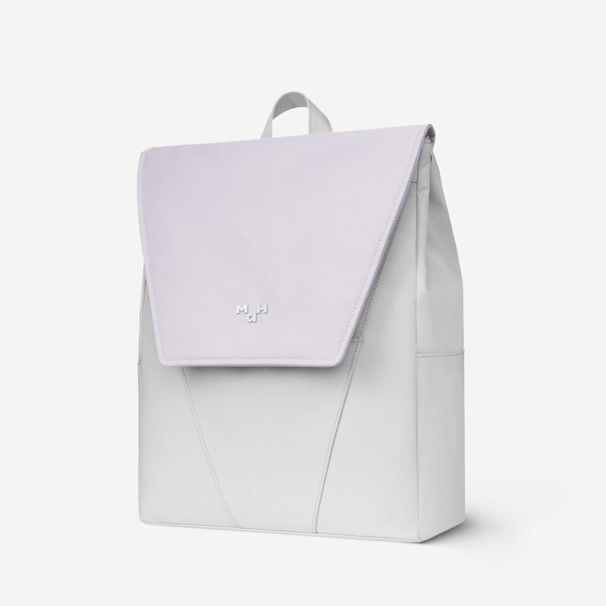 Minimalist light gray backpack with flap closure and subtle logo, ideal for daily use or travel