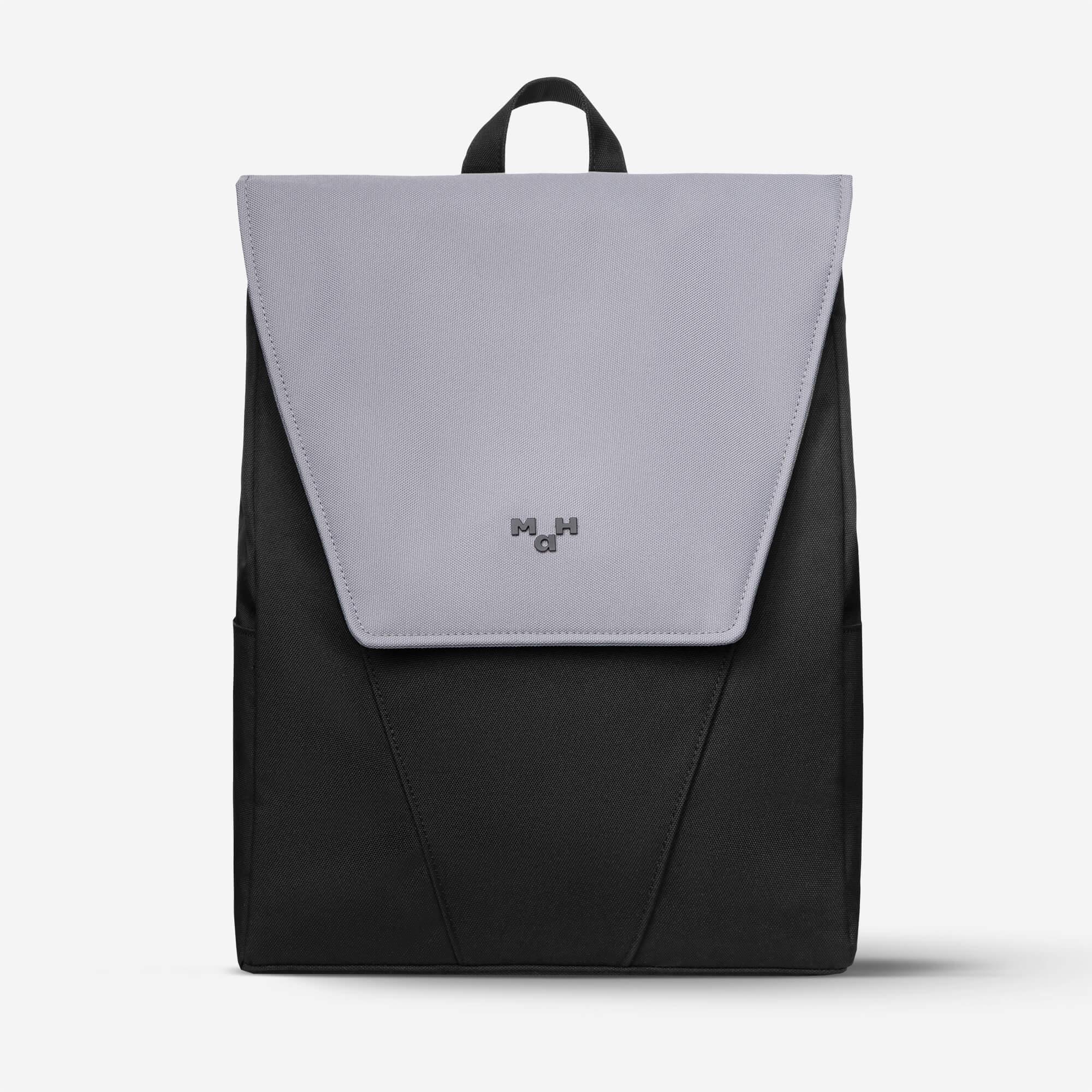 Modern black and gray backpack with flap closure and top handle, ideal for daily use or travel