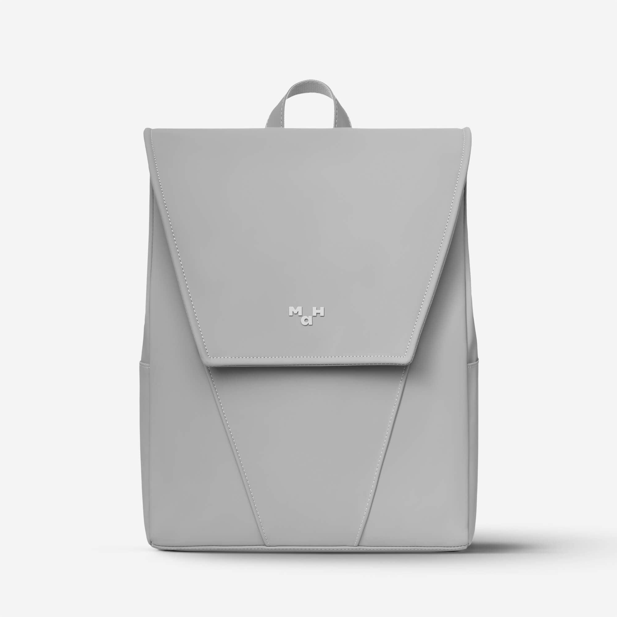 Light gray minimalist backpack with MaH logo, sleek design, and top handle for everyday use
