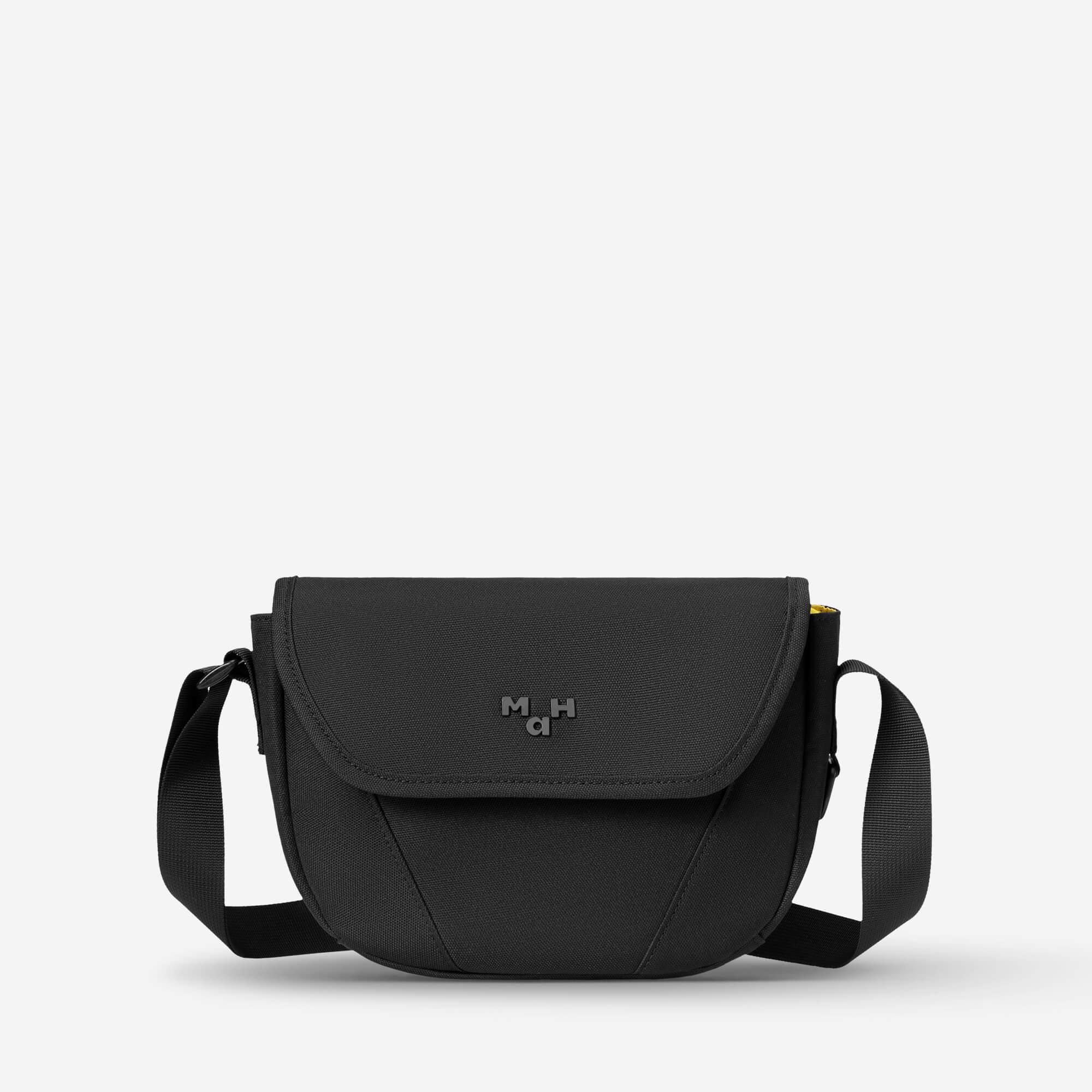 Black crossbody bag with adjustable strap and subtle logo, ideal for everyday carry and urban style.