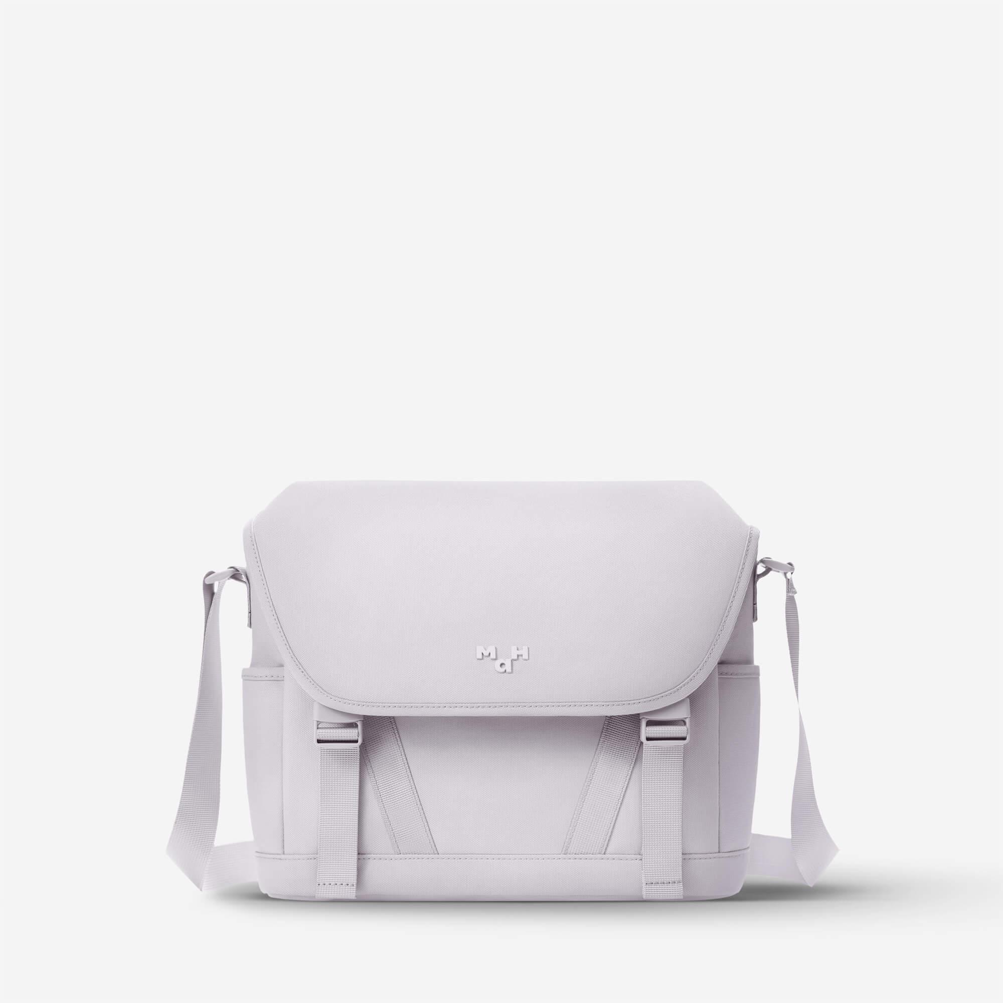 Light gray minimalist messenger bag with adjustable strap and front logo, ideal for daily commute or travel