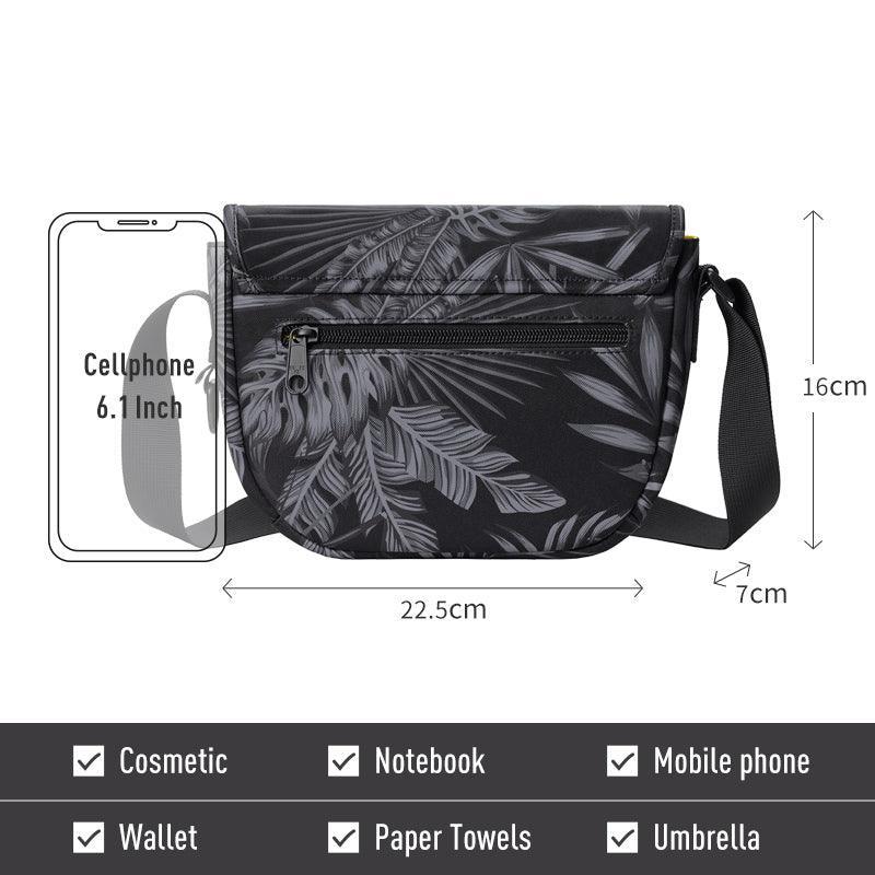Black tropical leaf print crossbody bag with dimensions, fits phone, wallet, notebook